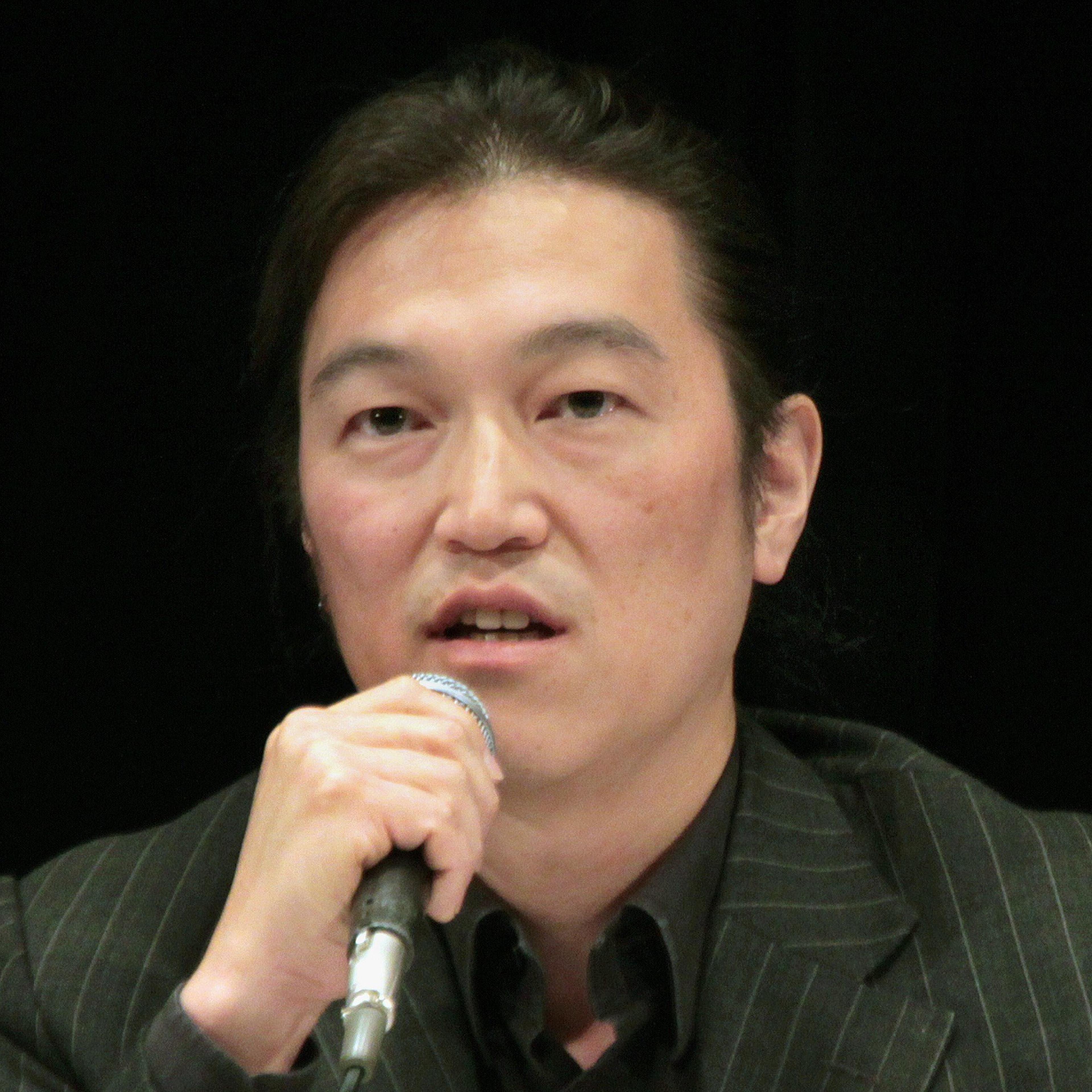Japanese journalist Kenji Goto delivering a lecture during a symposium in Tokyo on Oct. 27, 2010.