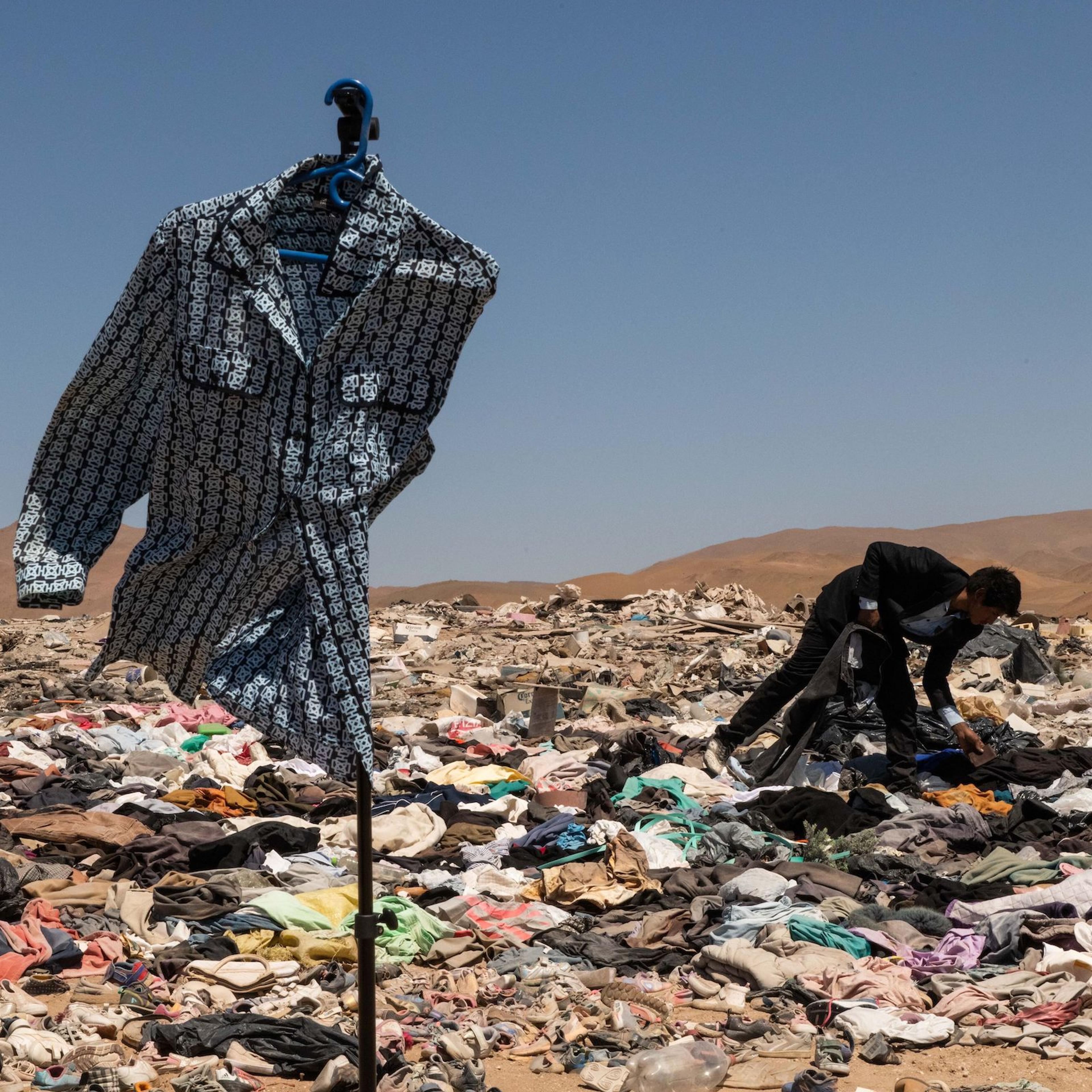 Millions of pieces of clothing lying in the middle of the desert are burned and turned into ash.