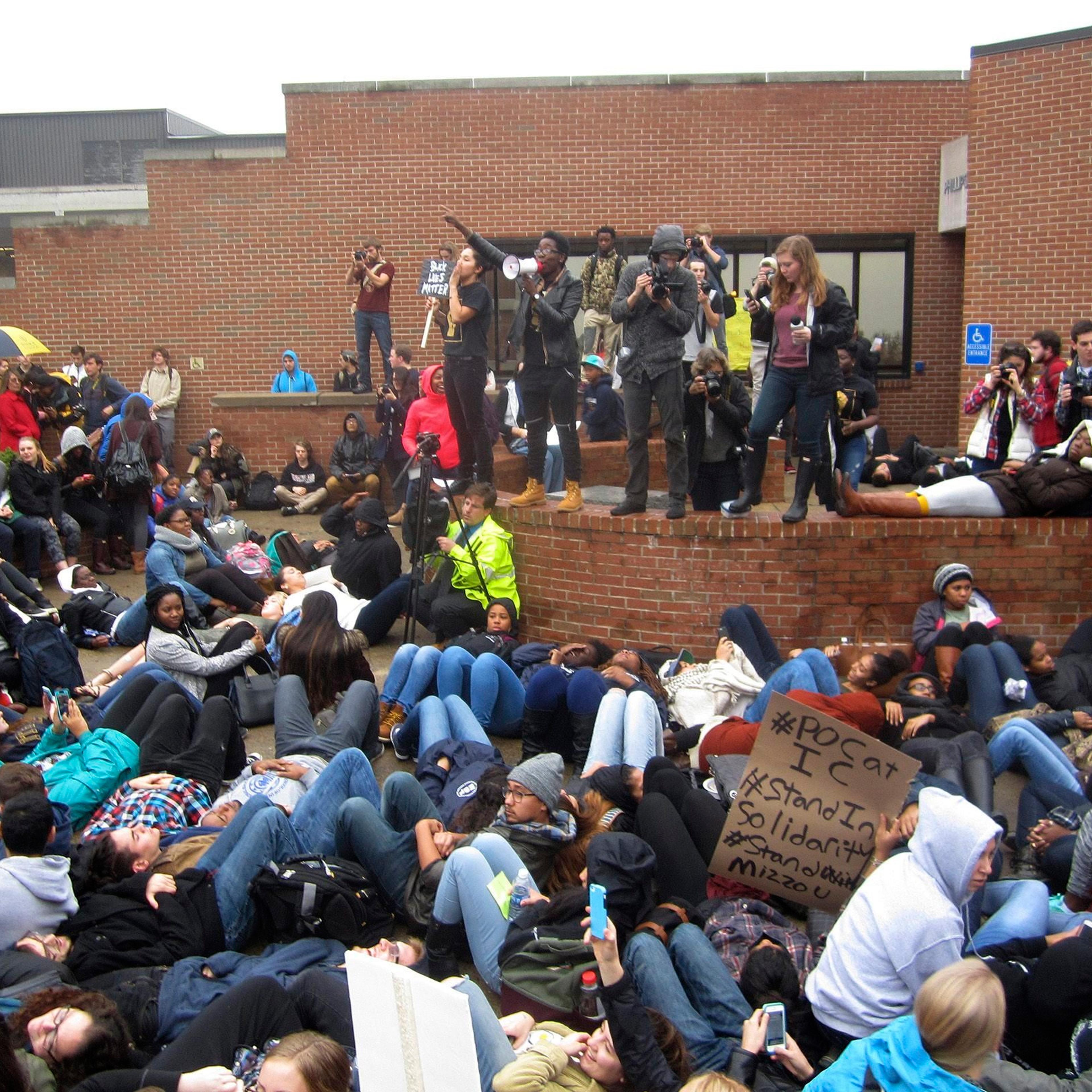 Protestorsr encourage students to lay down as part of a 'die-in' this afternoon at Ithaca College in Ithaca, New York on Nov. 11, 2015.
