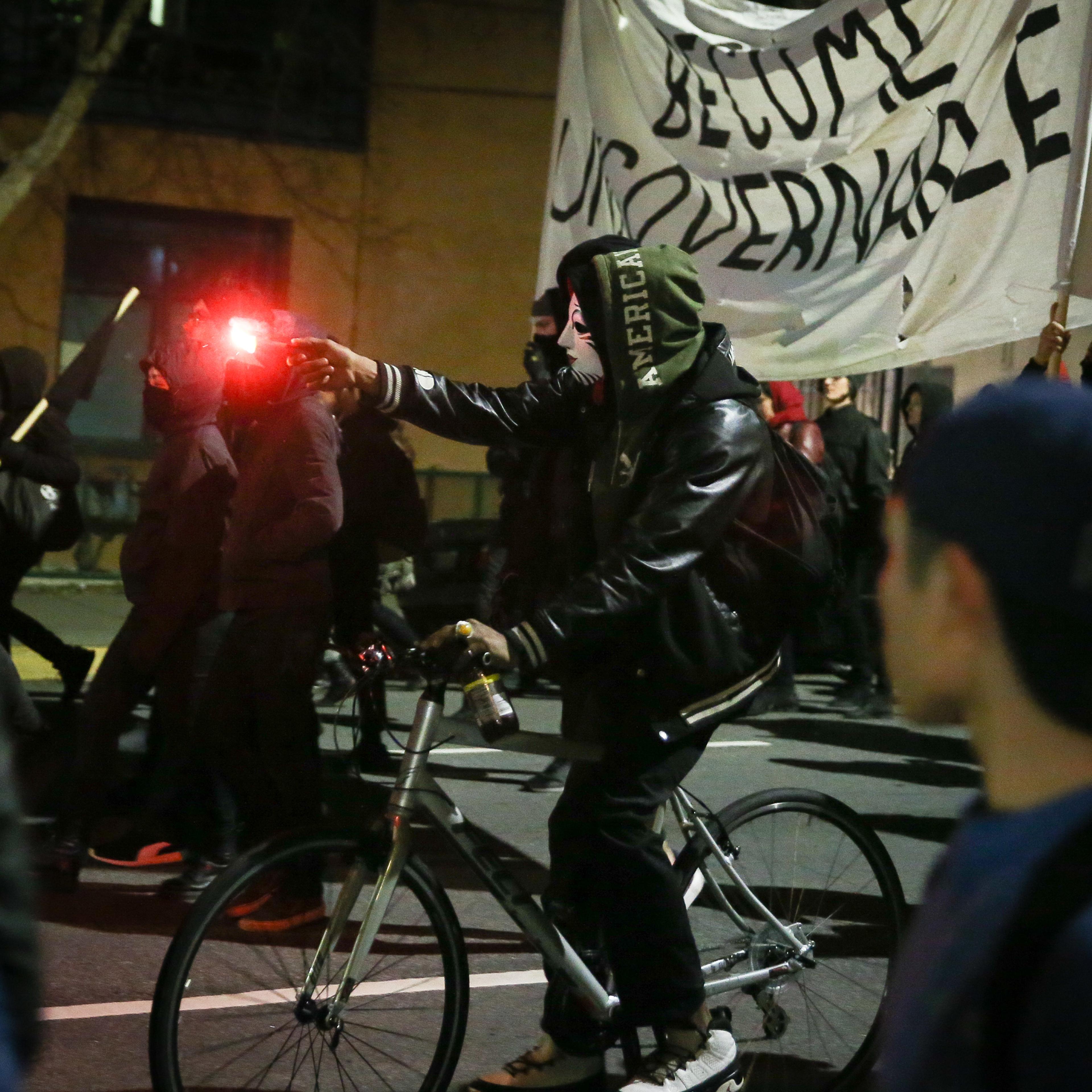 People protesting controversial Breitbart writer Milo Yiannopoulos march in the street in Berkeley, Calif., on Feb. 1, 2017.