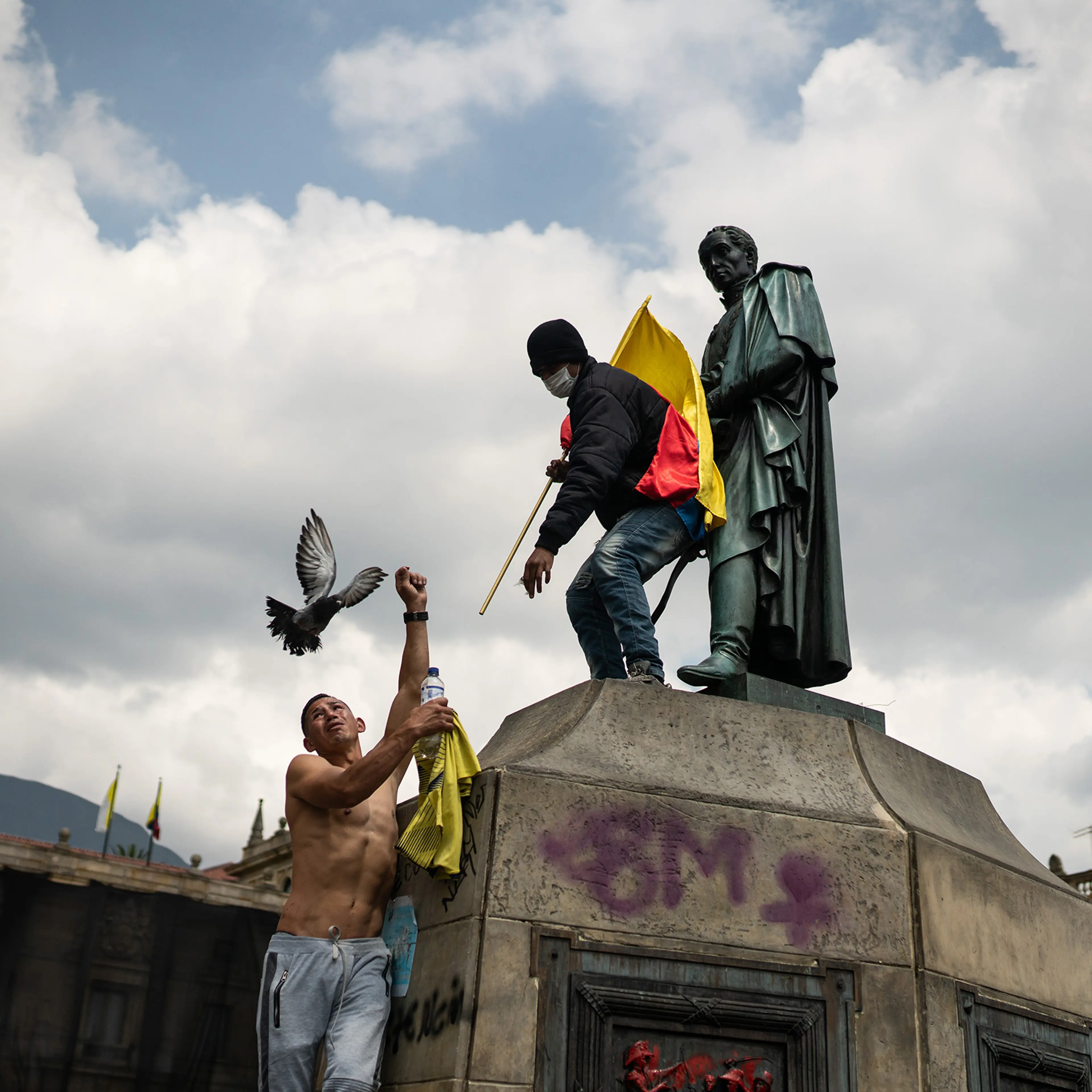 Protesters climb the sculpture of Simon Bolivar, thousands of Colombians take to the streets to protest against the government and the tax reform that would raise taxes on basic foodstuffs. Picture by Andrés Cardona.