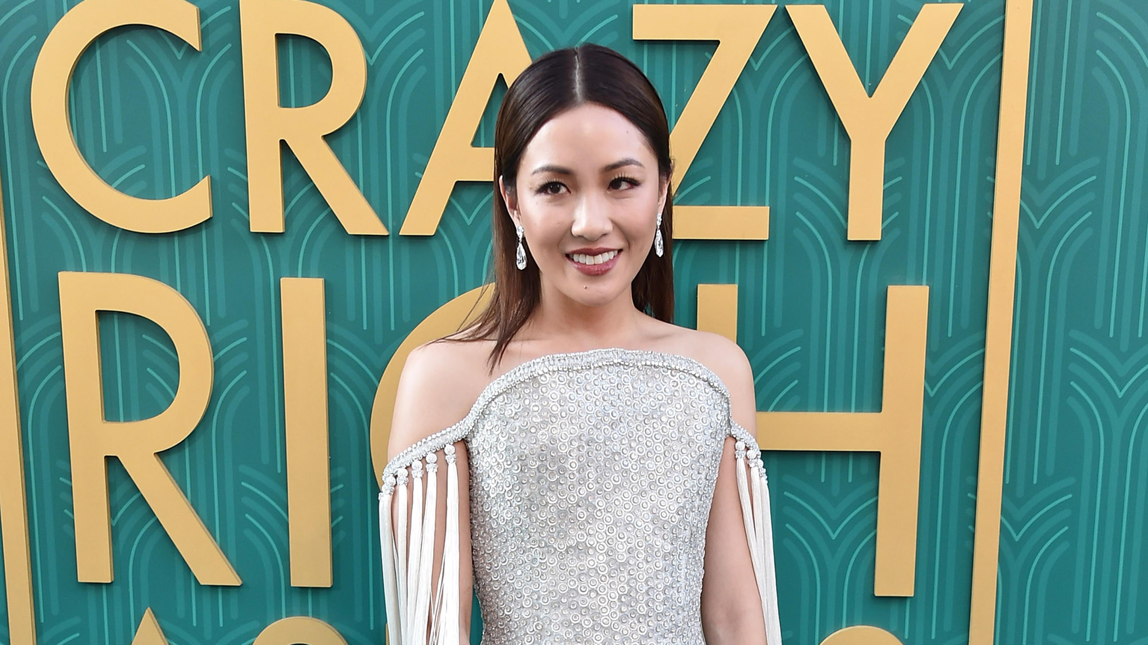 rachel chu red dress Based on the worldwide bestselling novel, CRAZY RICH ASIANS follows New Yorker Rachel Chu (Constance Wu) as she ventures to Singapore to meet her boyfriend's (crazy rich!) family for the first time.