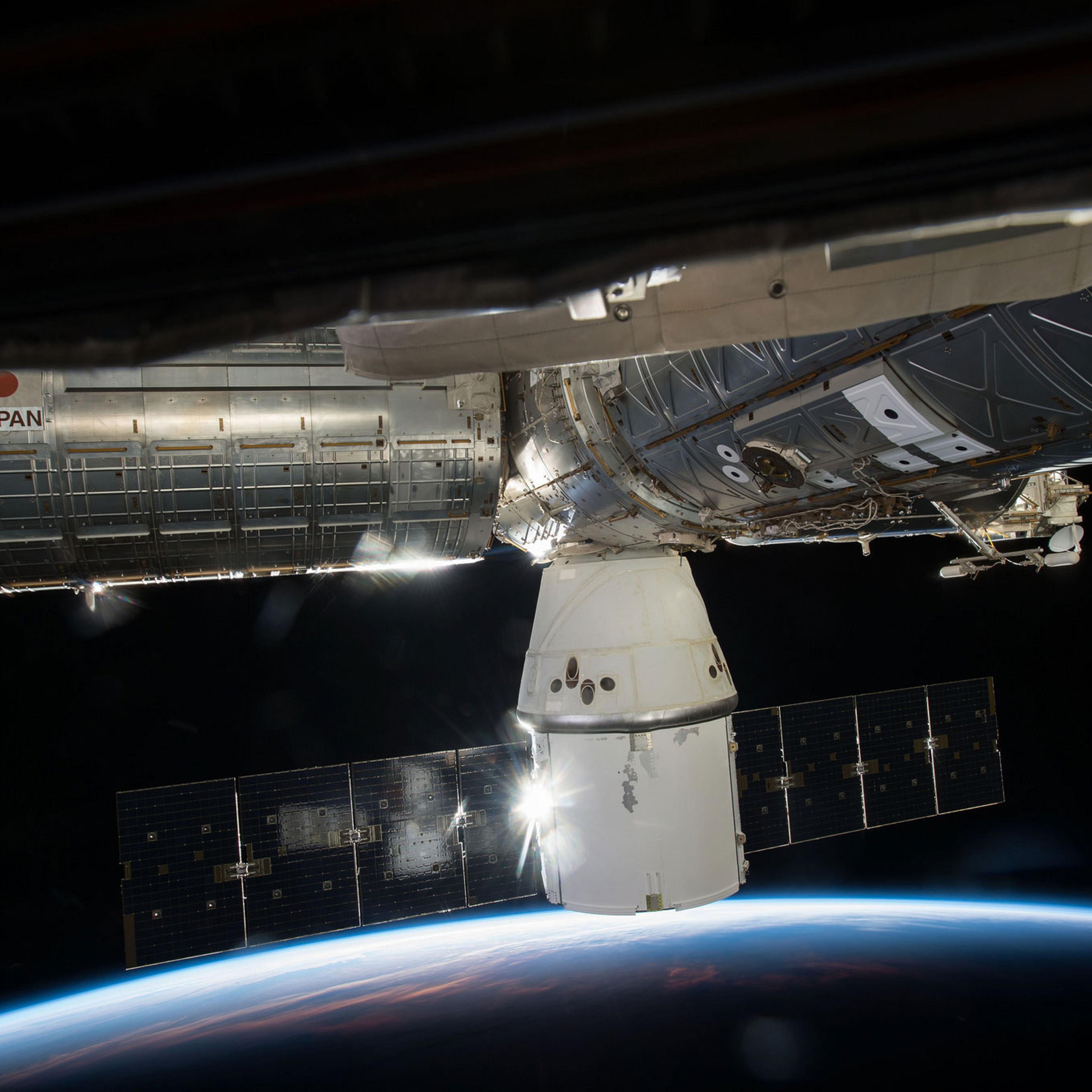 SpaceX's Dragon cargo capsule is seen here docked to the Earth-facing port of the Harmony module of the International Space Station. SpaceX's sixth commercial resupply flight arrived at the station on April 17.