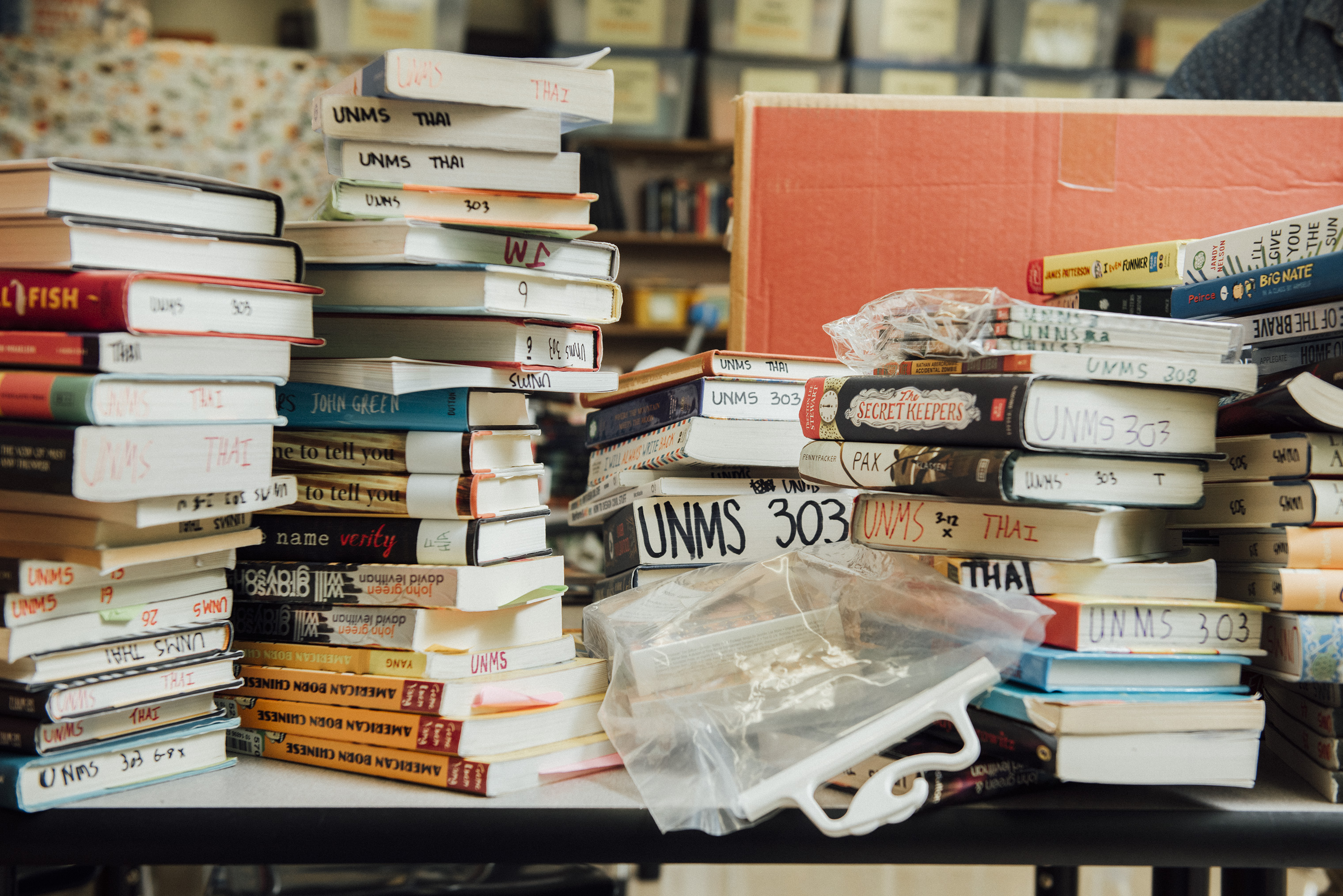 Stacks of books are organized in in Binh Thai's classroom at the University Neighborhood Middle School.