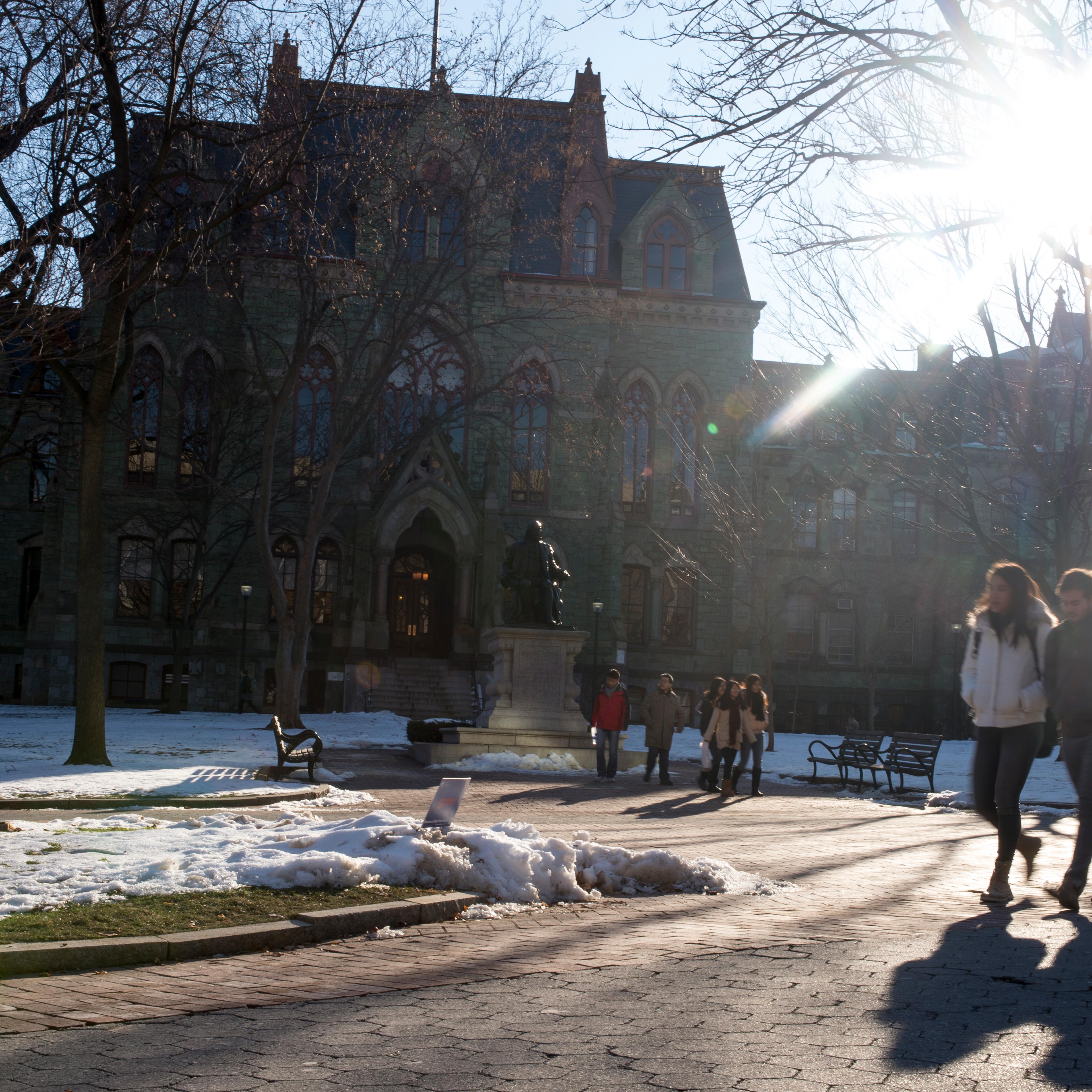Students walk through the University of Pennsylvania campus on December 16, 2013 in Philadelphia, Pennsylvania.