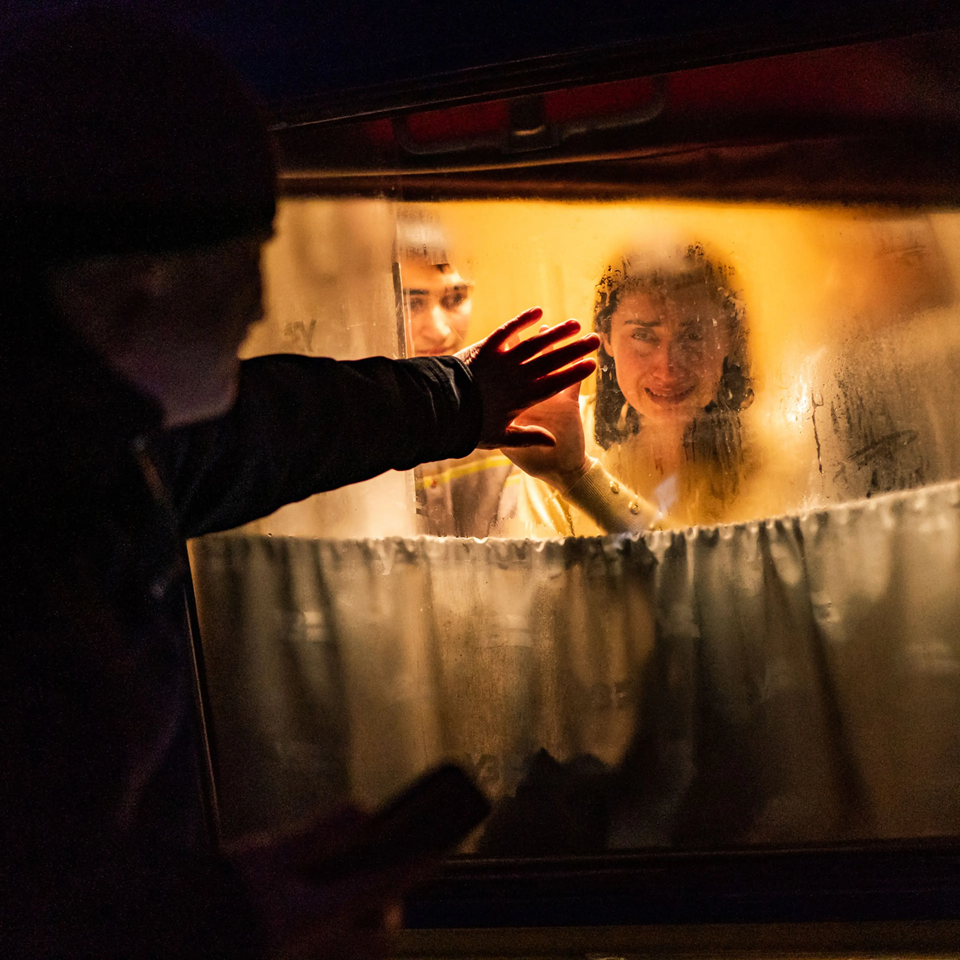 George Keburia says goodbye to his wife Maya and children as they board a train to Lviv at the Odessa train station in Odessa, Ukraine, on March 5.