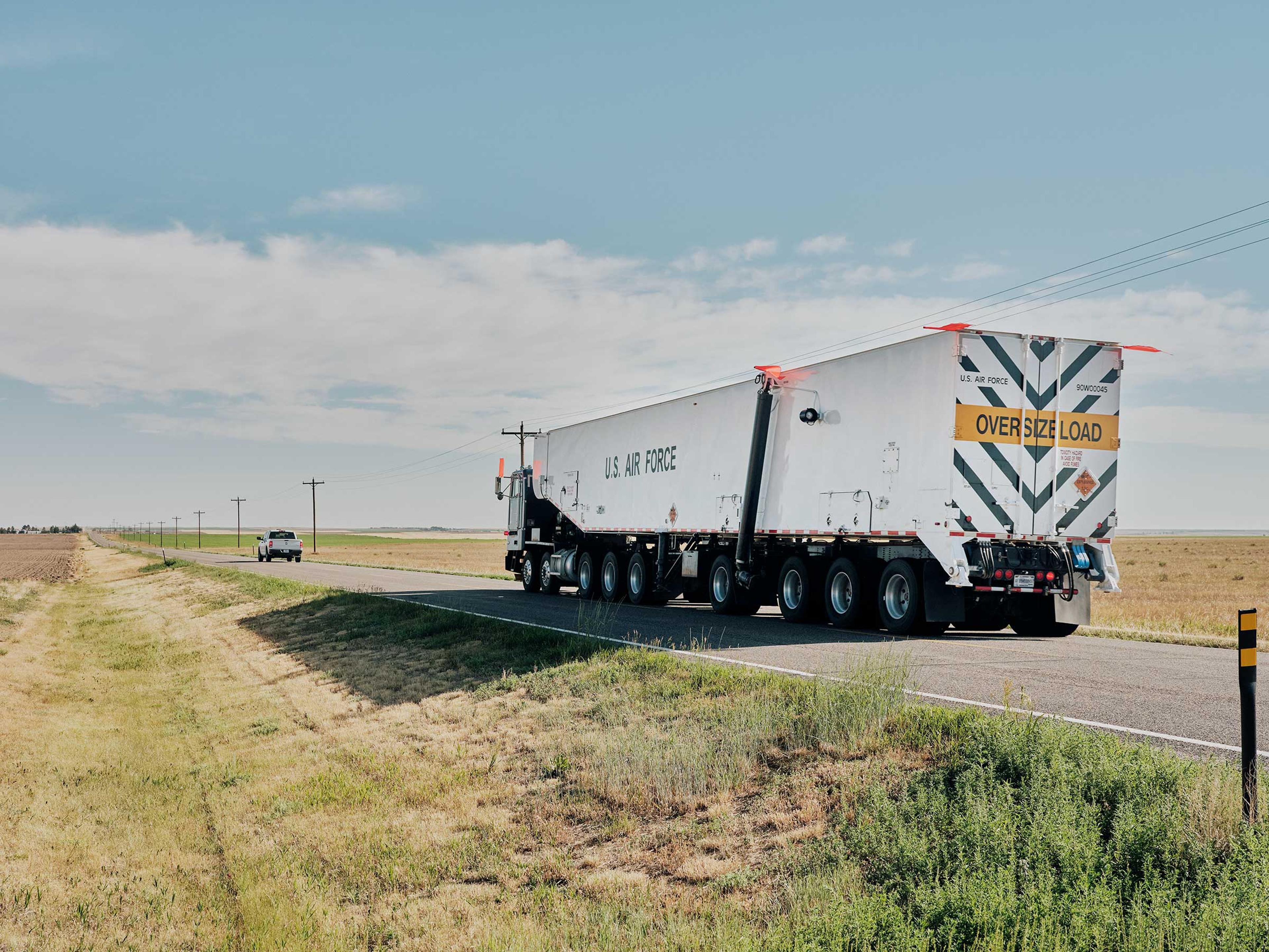 A military vehicle transports equipment on a mission to reinstall a Minuteman III at a missile silo in Pine Bluffs, Wyo.