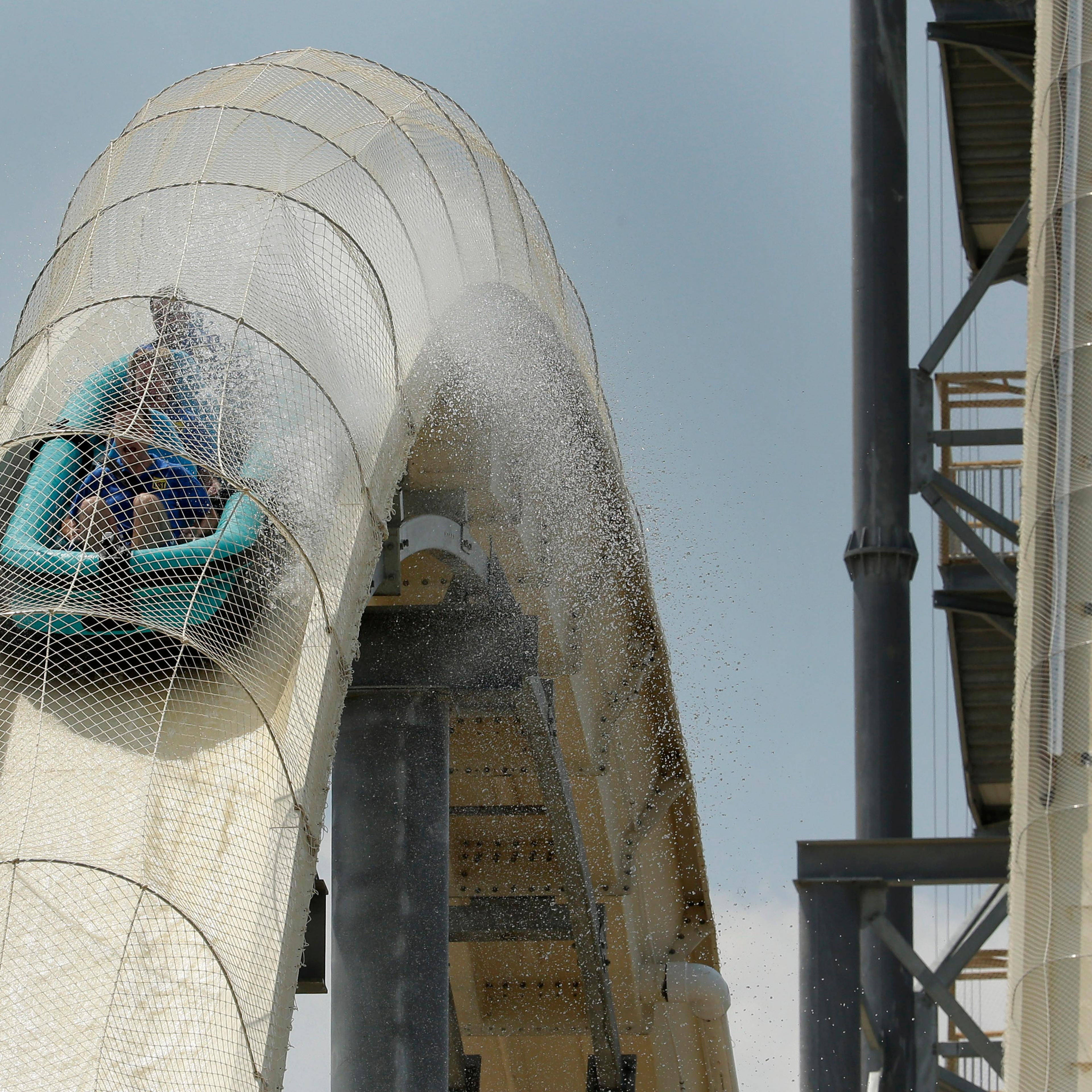 Riders are propelled by jets of water as the go over a hump while riding the world's tallest water slide called "Verruckt" at Schlitterbahn Waterpark, on July 9, 2014, in Kansas City, Kan.