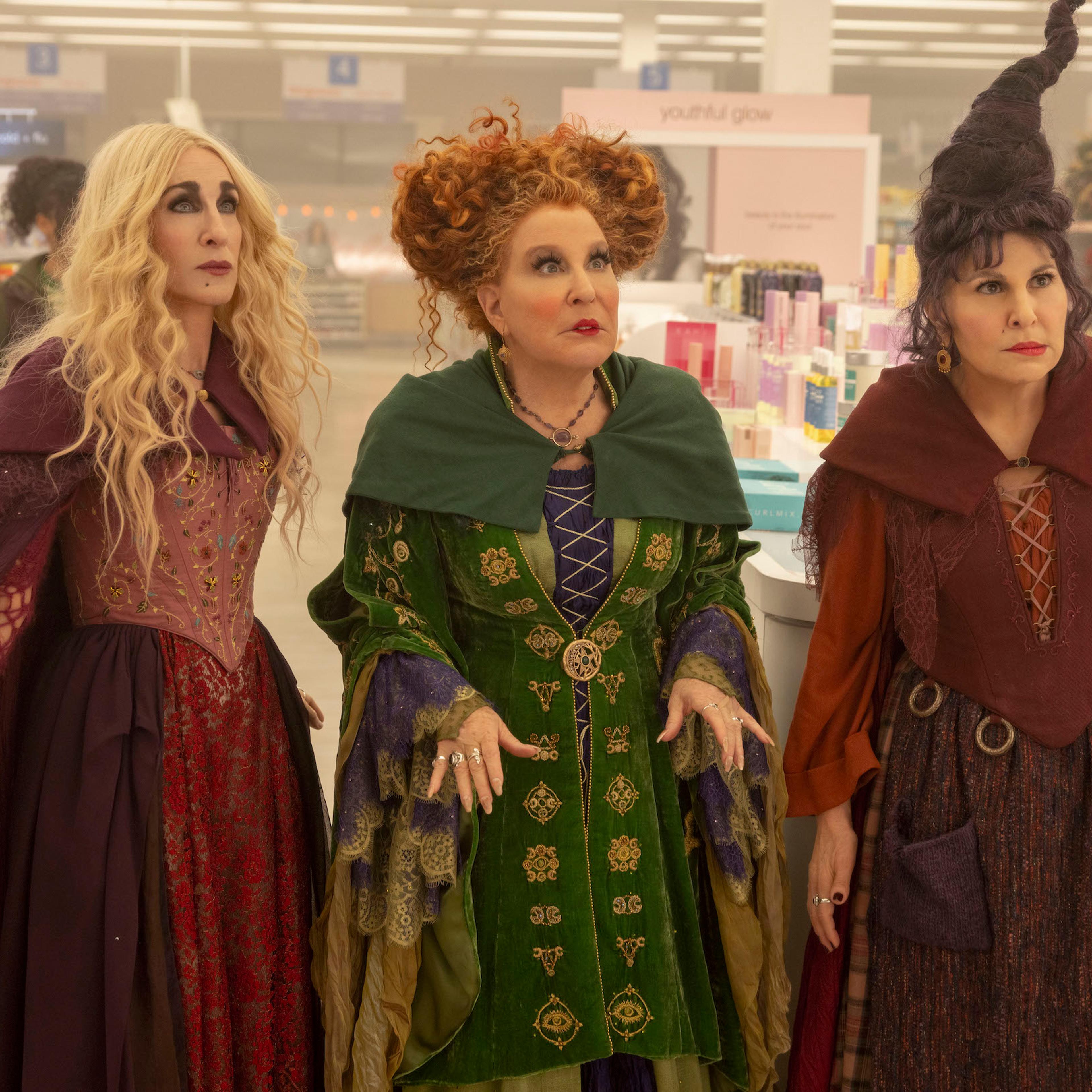 The Sanderson sisters stand, dazed and confused, inside a modern Walgreens
