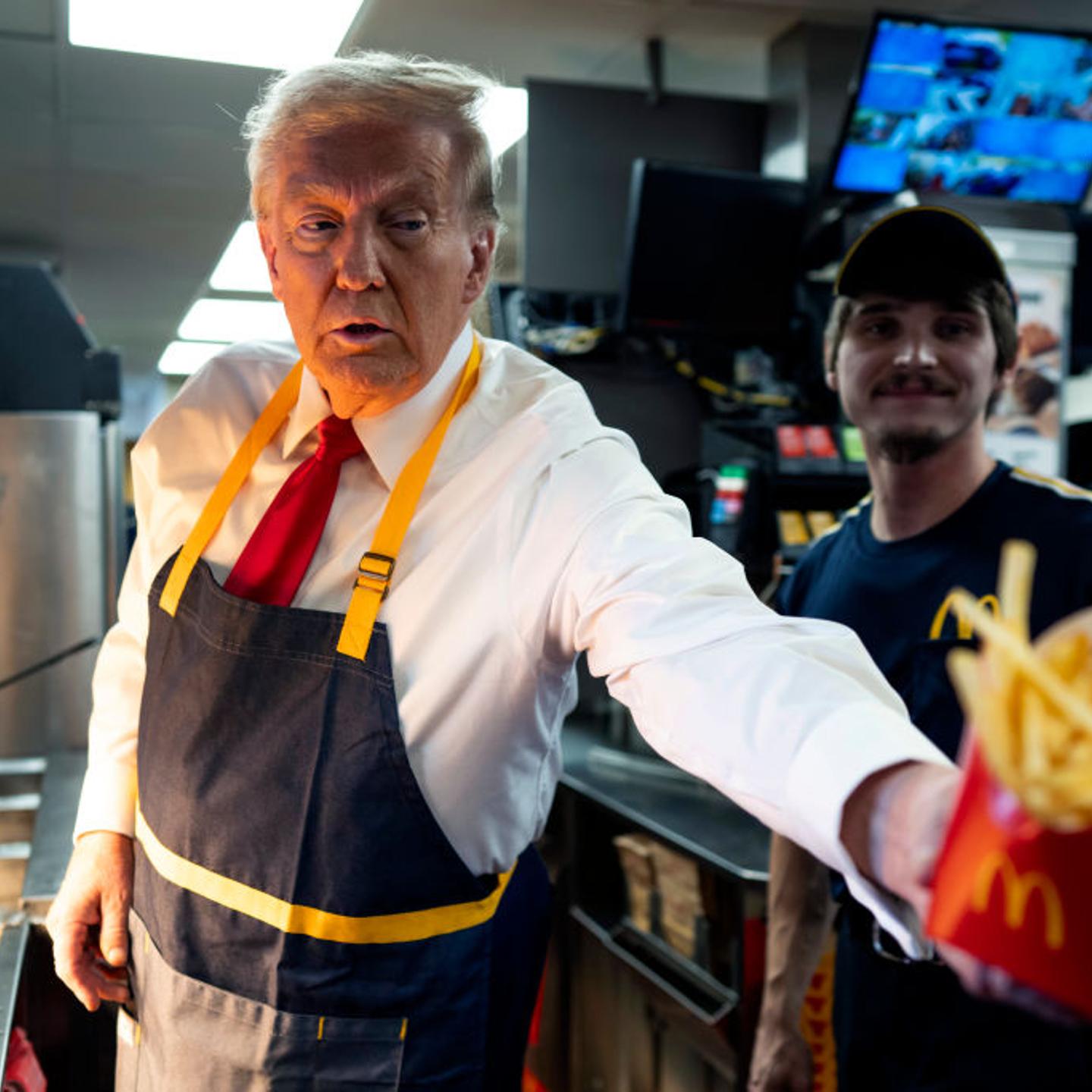 Republican presidential nominee, former U.S. President Donald Trump works behind the counter during a visit to McDonald's restaurant in Feasterville-Trevose, Pa., on Oct. 20, 2024.