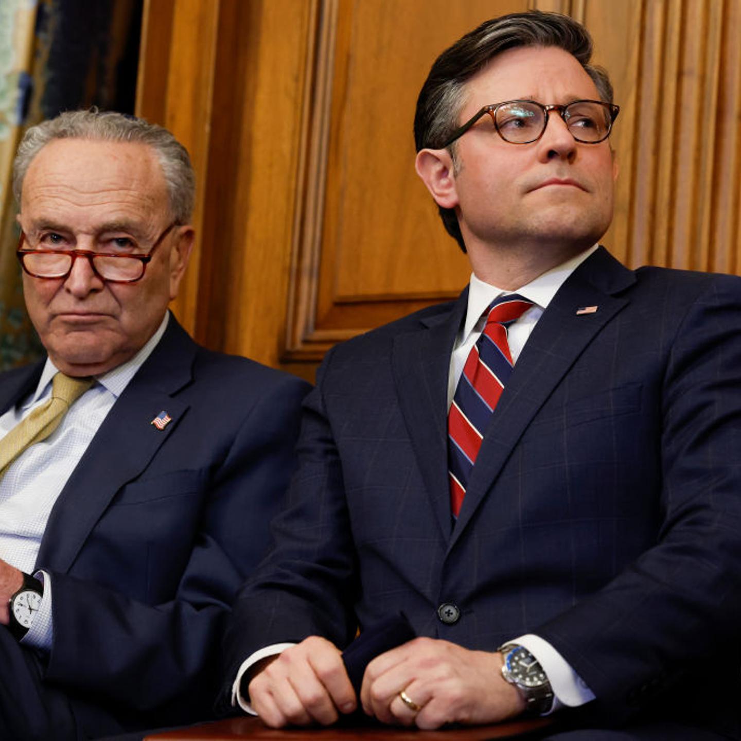 Senate Majority Leader Chuck Schumer (D., N.Y.) and U.S. Speaker of the House Mike Johnson (R., La.) listen during remarks at a Capitol Menorah lighting ceremony at the U.S. Capitol Building in Washington, D.C. on Dec. 12, 2023.