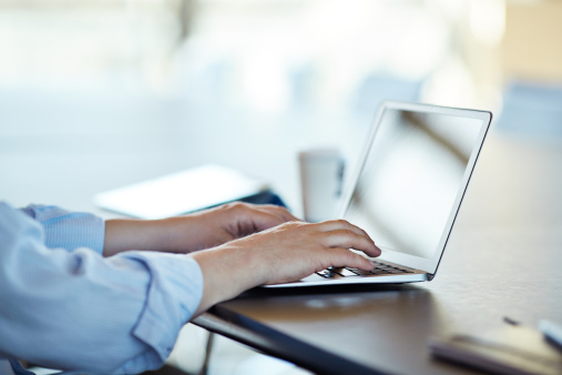 hands-typing-laptop