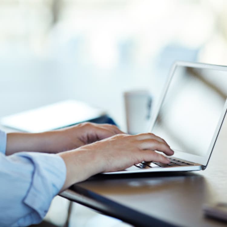 hands-typing-laptop