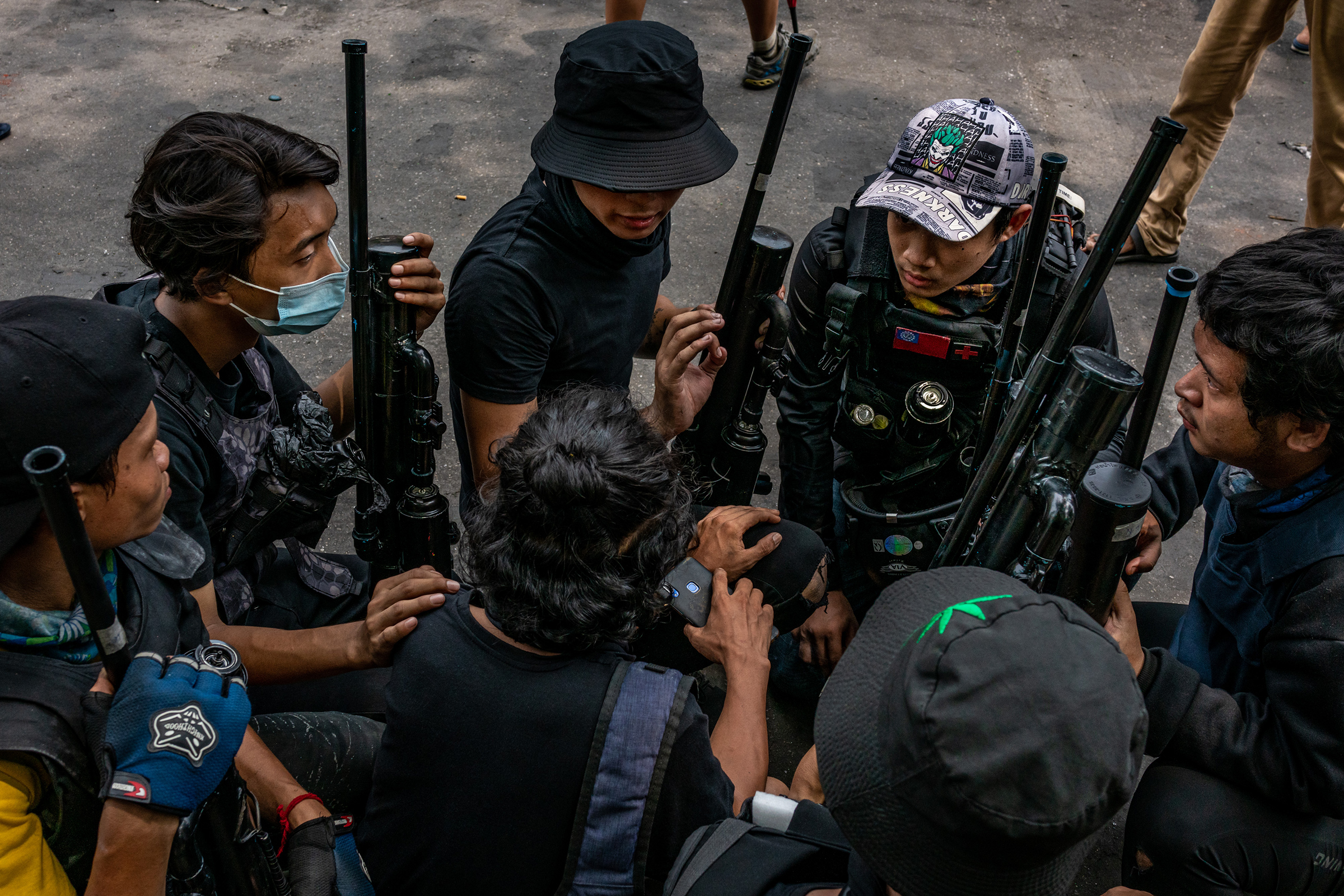 Anti-coup protesters hold improvised weapons during a protest in Yangon, Myanmar, on April 3, 2021.