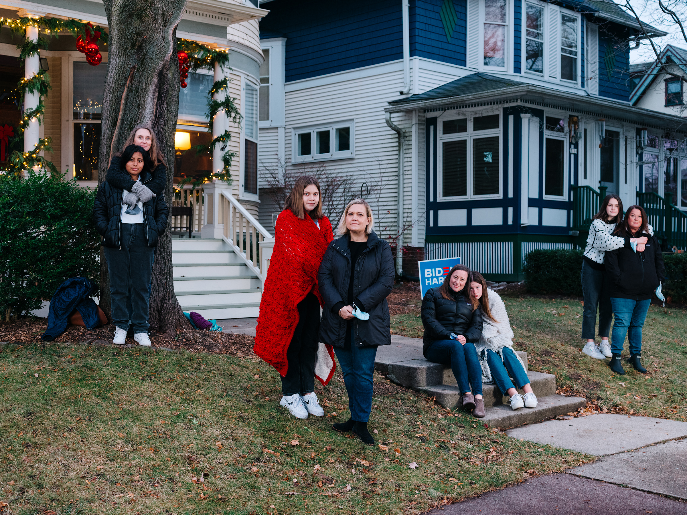 Biden/Harris supporters (from left) Lorna Dilley and Faith Coffaro, Maggie and Carrie Killoran, Caroline Cahill and Eileen Force Cahill, and Alice Stephens and Lulu Rorabeck, on Milwaukee's East Side on Dec. 5, 2020.