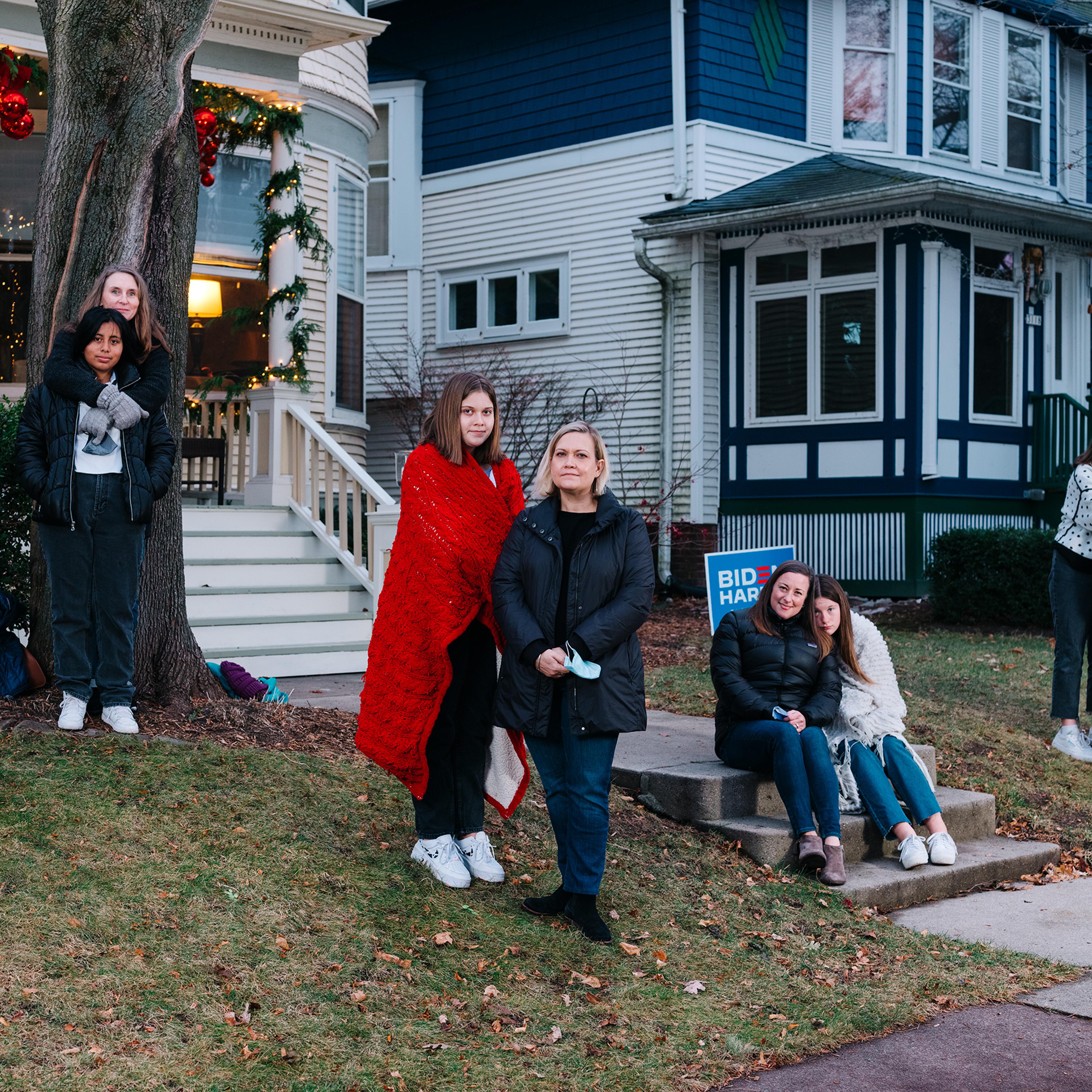 Biden/Harris supporters (from left) Lorna Dilley and Faith Coffaro, Maggie and Carrie Killoran, Caroline Cahill and Eileen Force Cahill, and Alice Stephens and Lulu Rorabeck, on Milwaukee's East Side on Dec. 5, 2020.