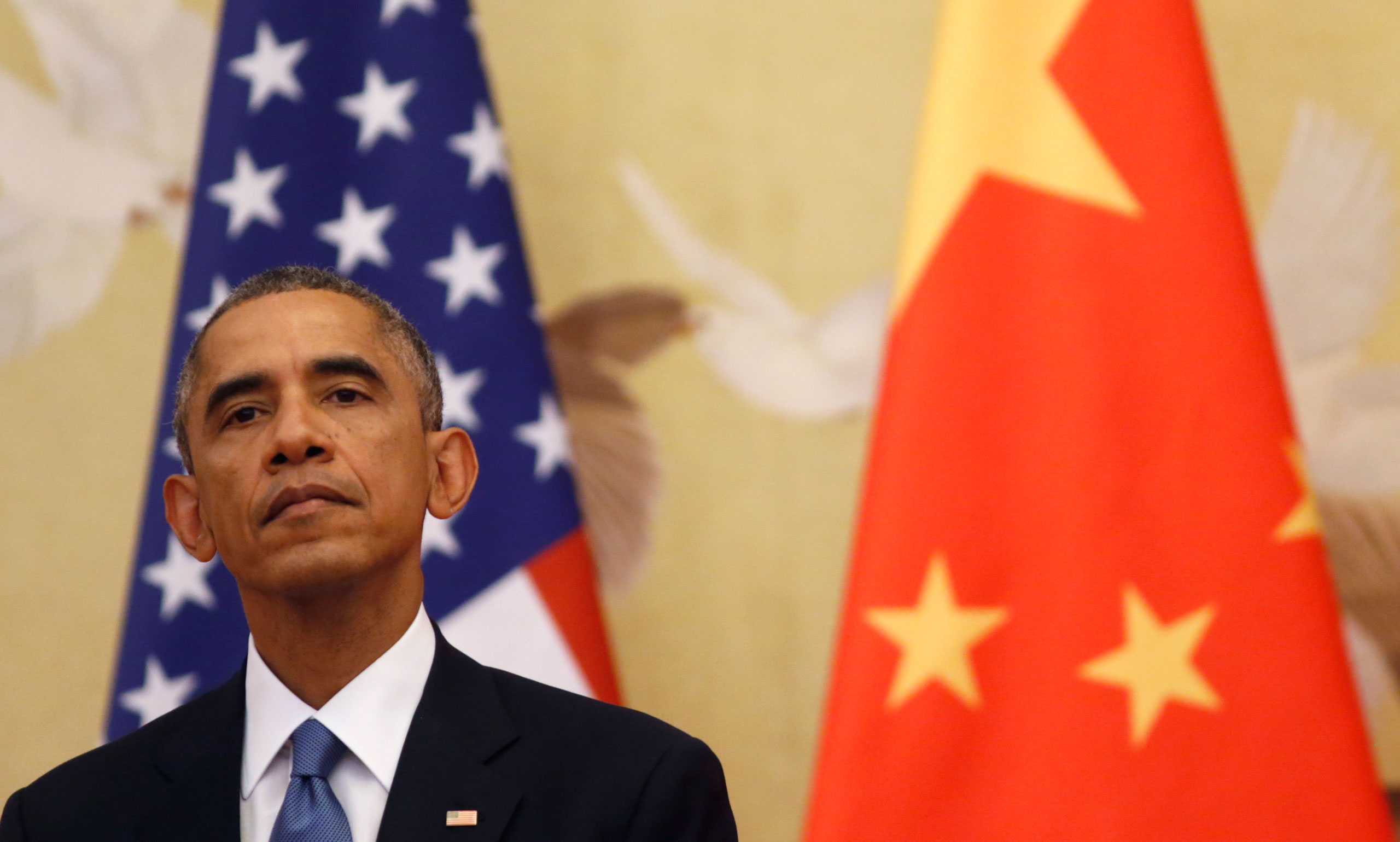 12 Nov 2014, Beijing, China --- U.S. President Barack Obama looks up as he and Chinese President Xi Jinping hold a news conference in the Great Hall of the People in Beijing November 12, 2014. Obama will travel to Myanmar and Australia as part of a week-