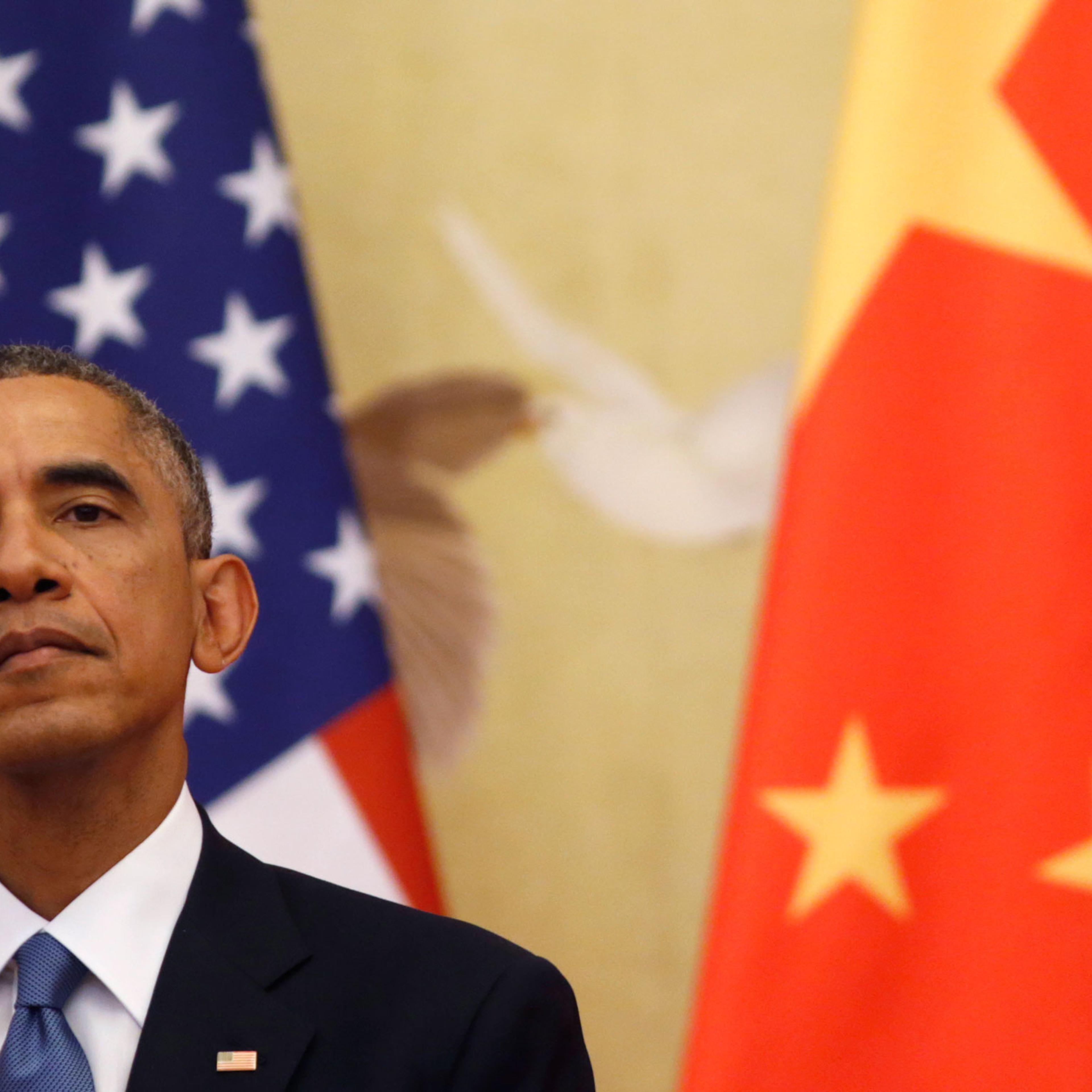 12 Nov 2014, Beijing, China --- U.S. President Barack Obama looks up as he and Chinese President Xi Jinping hold a news conference in the Great Hall of the People in Beijing November 12, 2014. Obama will travel to Myanmar and Australia as part of a week-