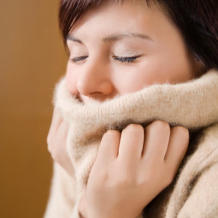 woman-turtleneck-shivering