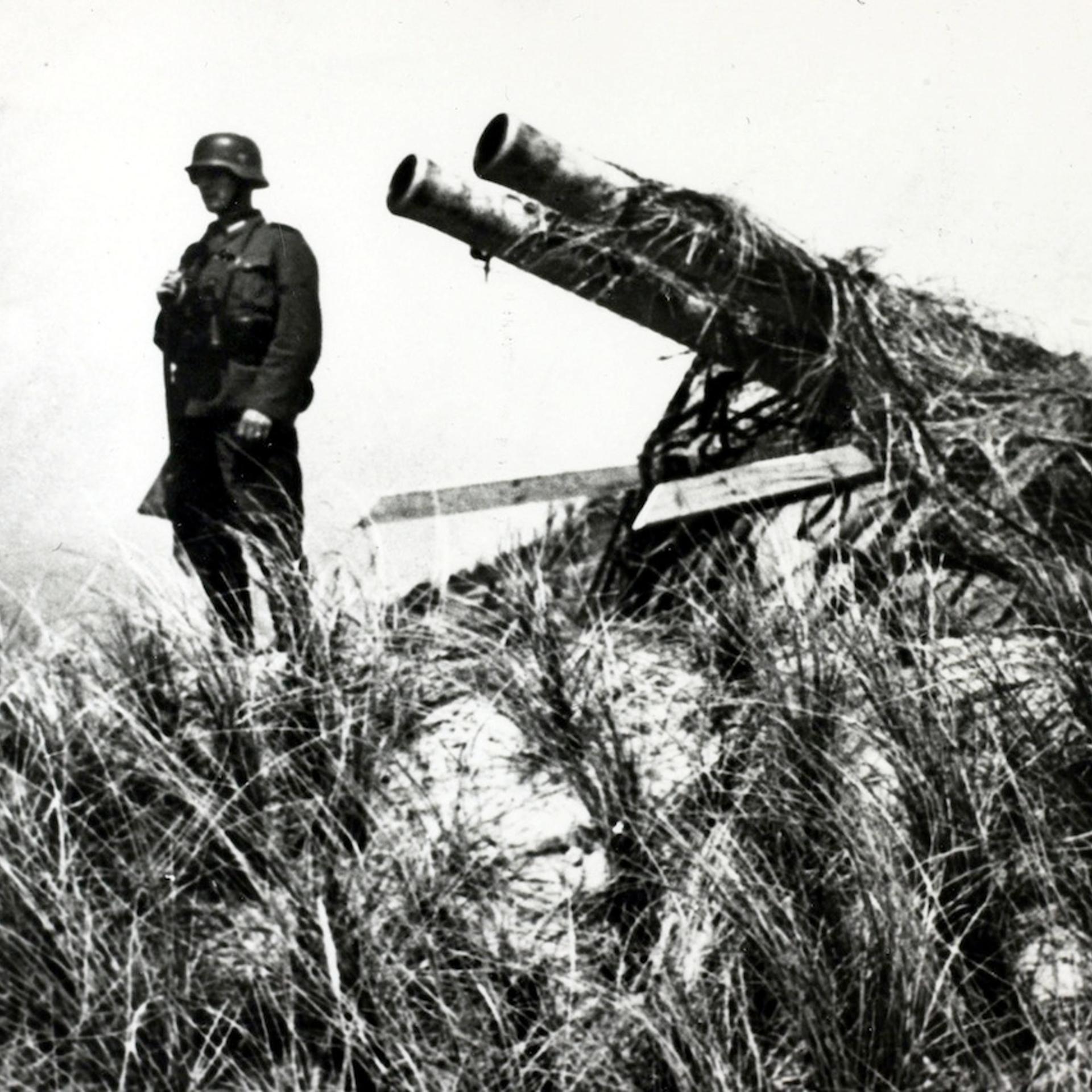 War and Conflict. World War II. pic: May 1940. A German soldier stands guard over a captured Dutch gun on the island of Texel. Germany invaded Belgium, Holland and Luxembourg in May 1940 claiming justification because they feared that the Allies, (France