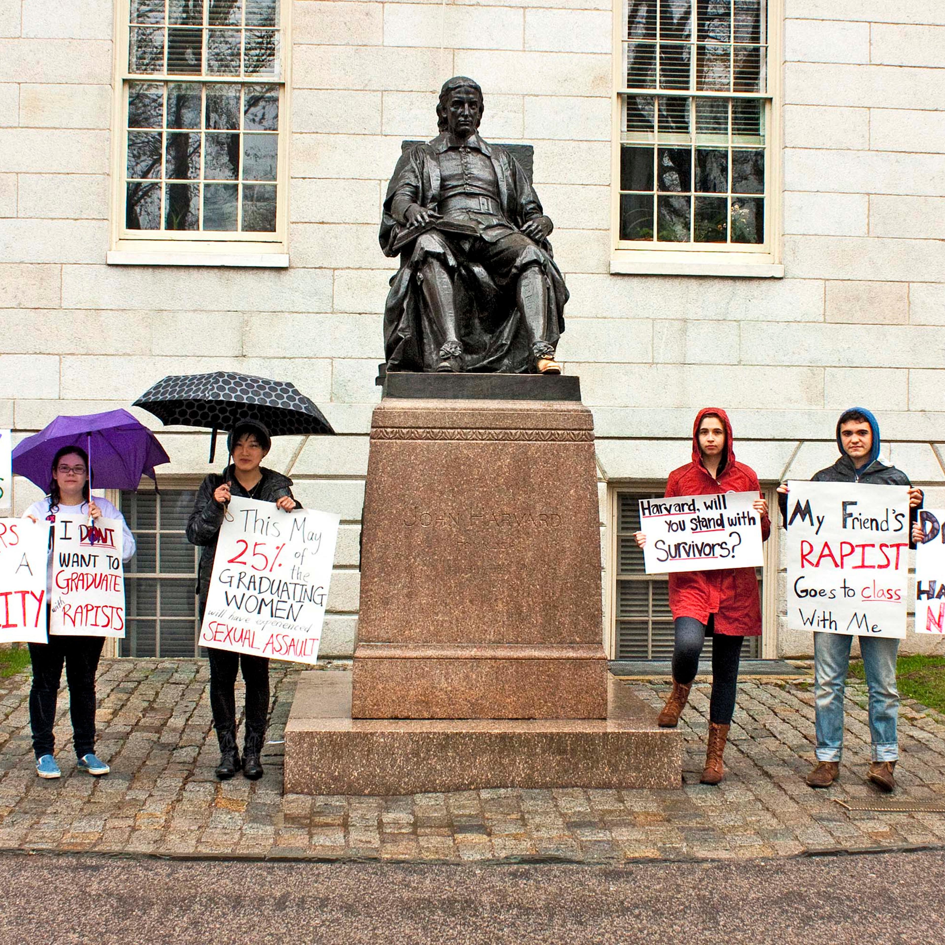 Students protest Harvard’s handling of sexual-assault allegations in front of a statue of John Harvard in April.