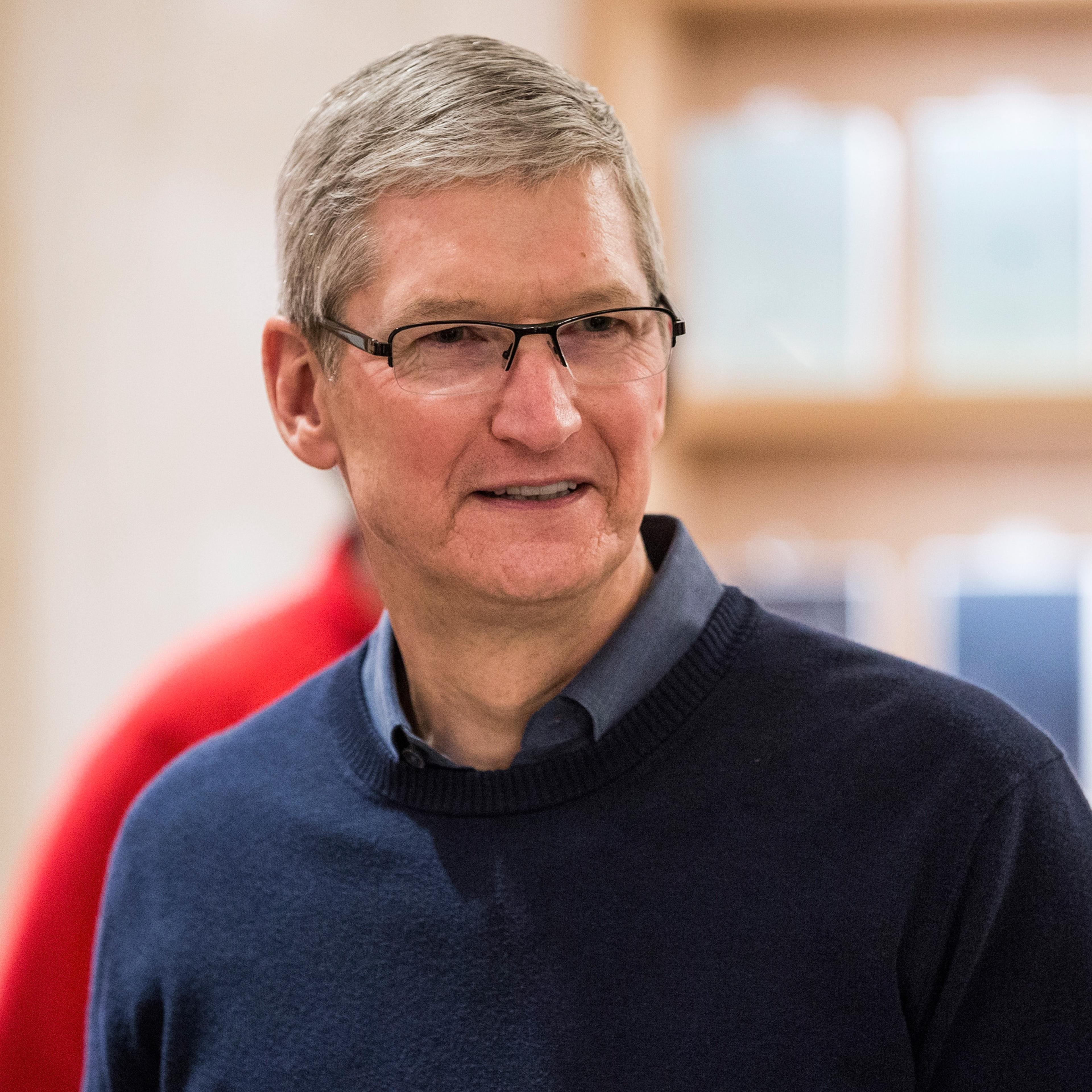 Tim Cook, CEO of Apple, visits an Apple store where third grade children from PS 57 James Weldon Johnson Leadership Academy are learning how to code through Apple's "Hour of Code" workshop program on December 9, 2015 in New York City.