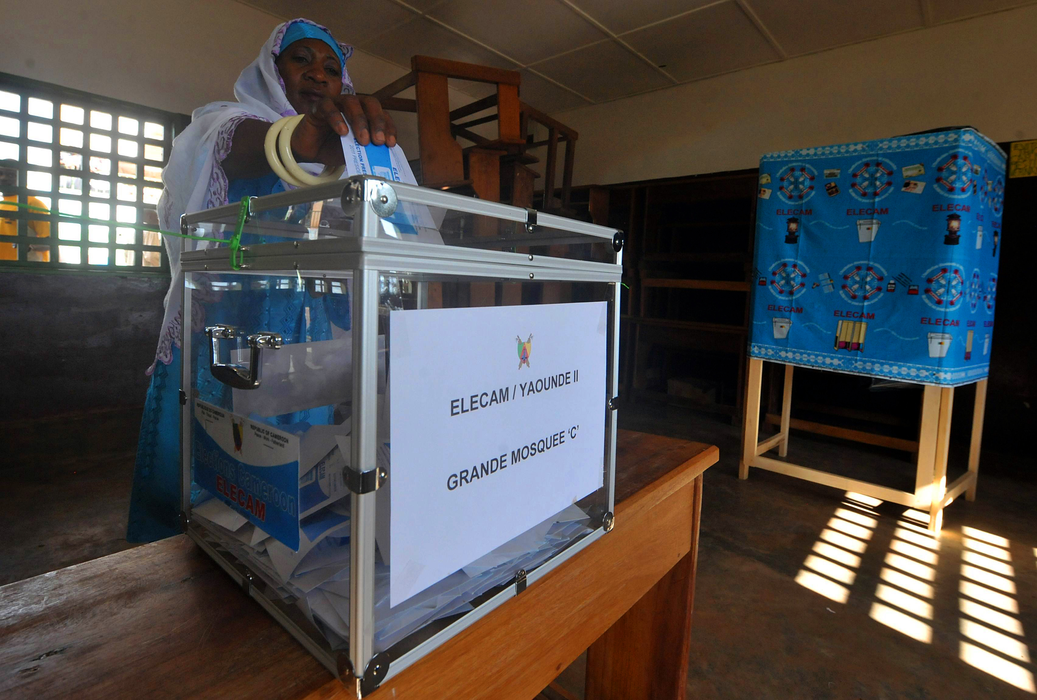 A Cameroonian casts her vote at a polling station in Yaoundé, Cameroon on Oct. 9, 2011.