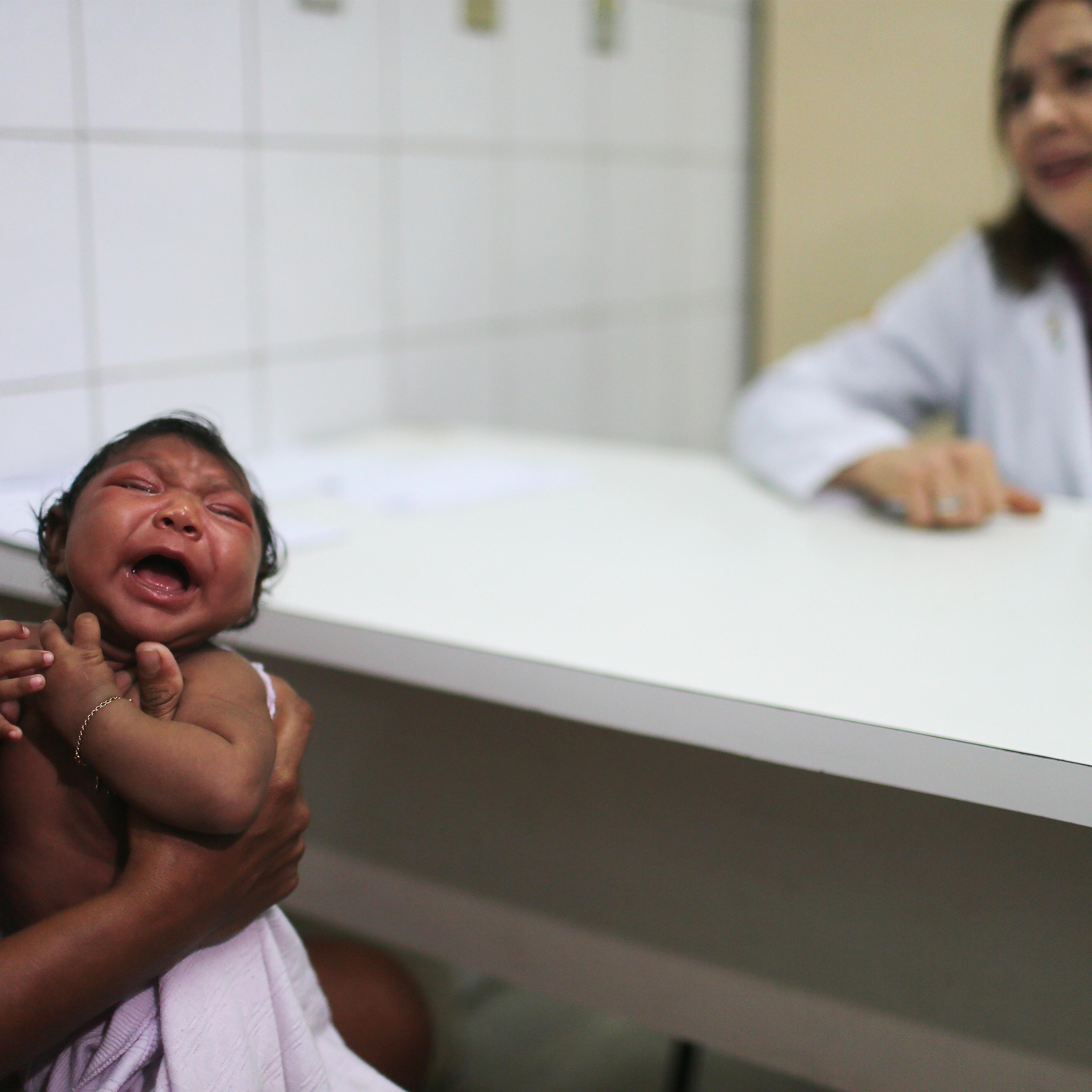 Dr. Angela Rocha (right), pediatric infectologist at Oswaldo Cruz Hospital, speaks during an examination of Ludmilla Hadassa Dias de Vasconcelos (2 months), who has microcephaly, in Recife, Brazil, on Jan. 26, 2016.