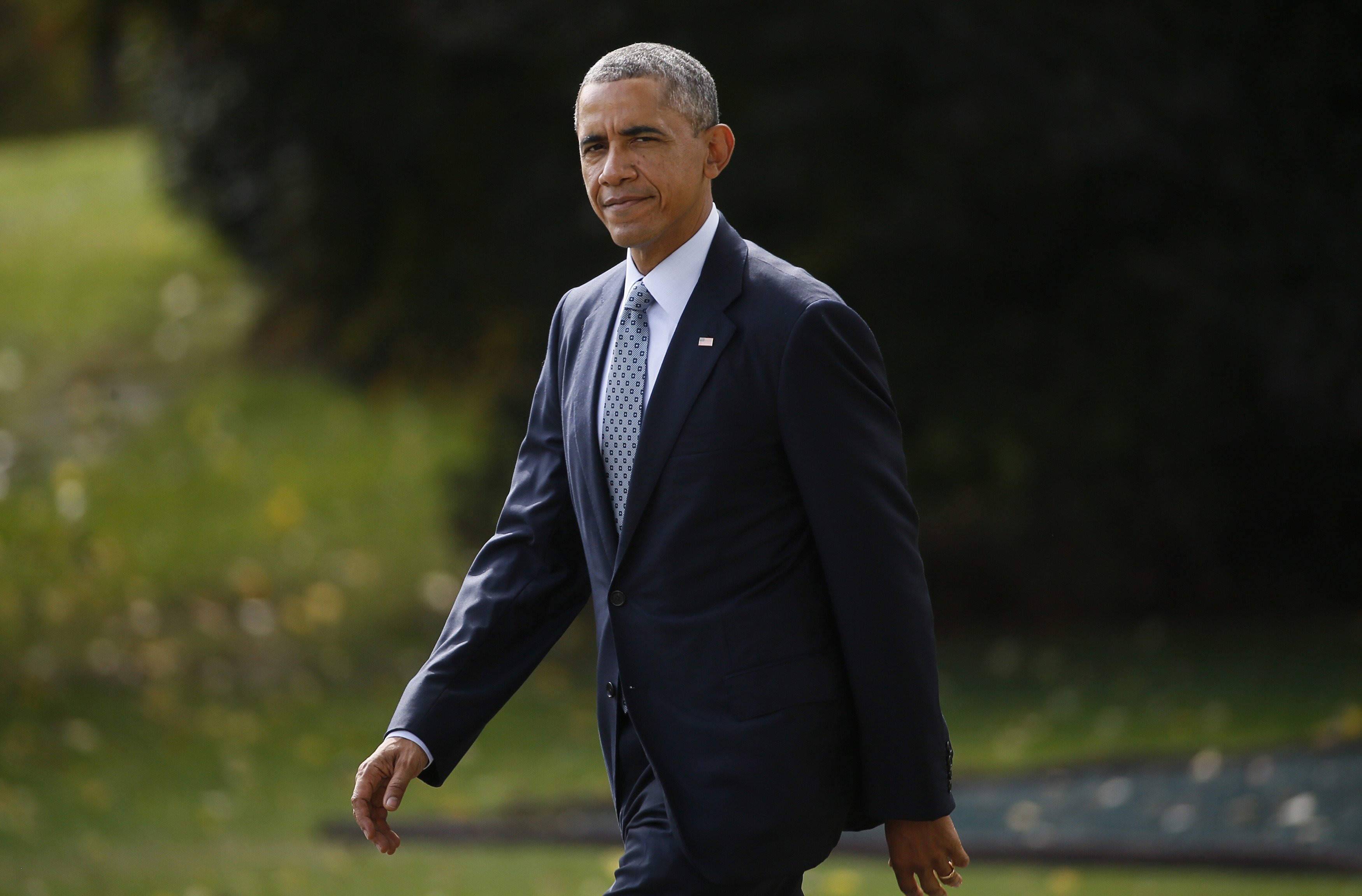 President Obama heads to the Marine One helicopter to travel to Andrews Air Force Base for a meeting with foreign defense chiefs from more than 20 countries including Turkey and Saudi Arabia on strategies for fighting Islamic State, in Washington