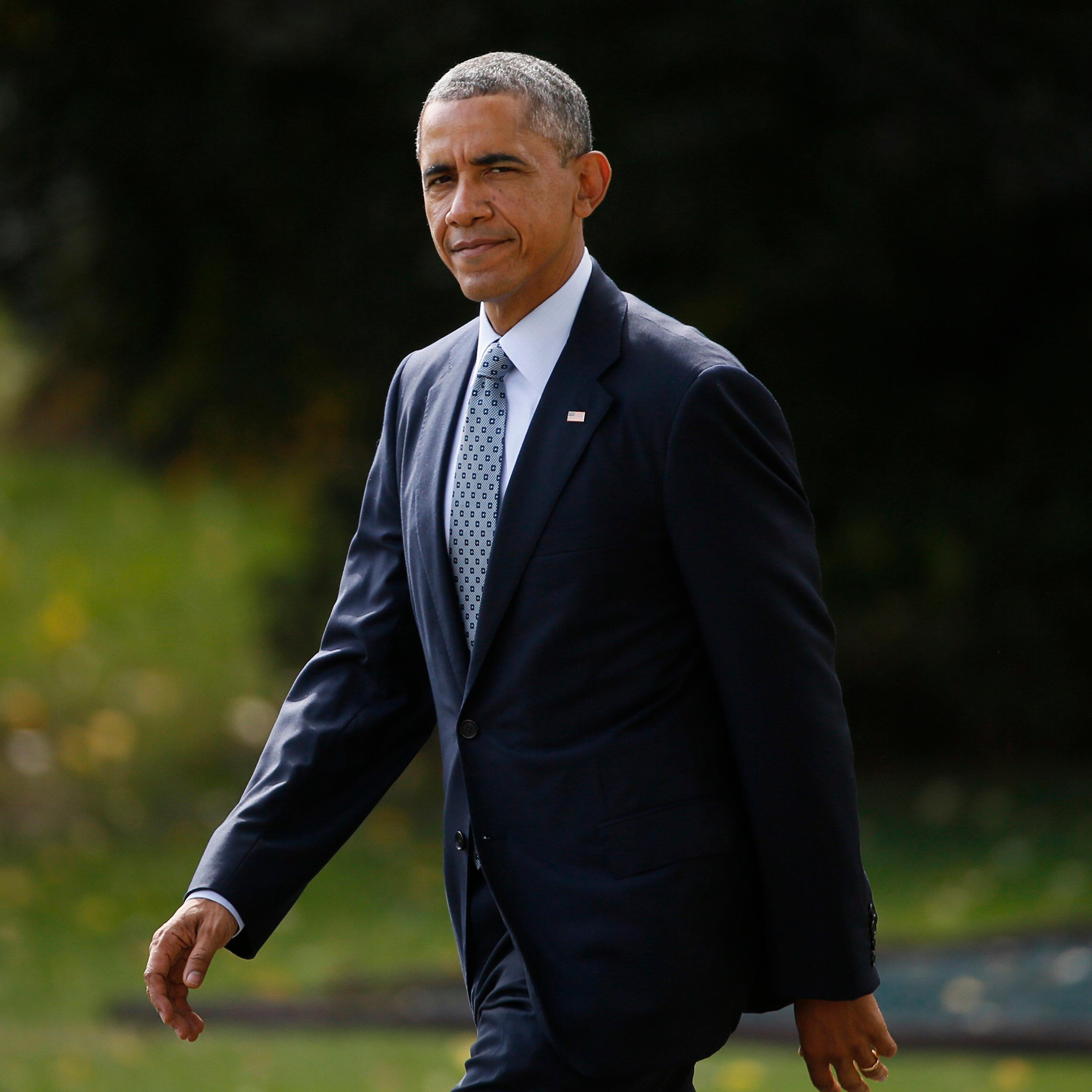 President Obama heads to the Marine One helicopter to travel to Andrews Air Force Base for a meeting with foreign defense chiefs from more than 20 countries including Turkey and Saudi Arabia on strategies for fighting Islamic State, in Washington