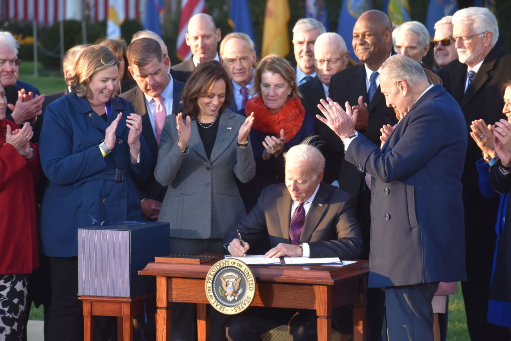 President of the United States Joe Biden signs the Bipartisan Infrastructure Deal