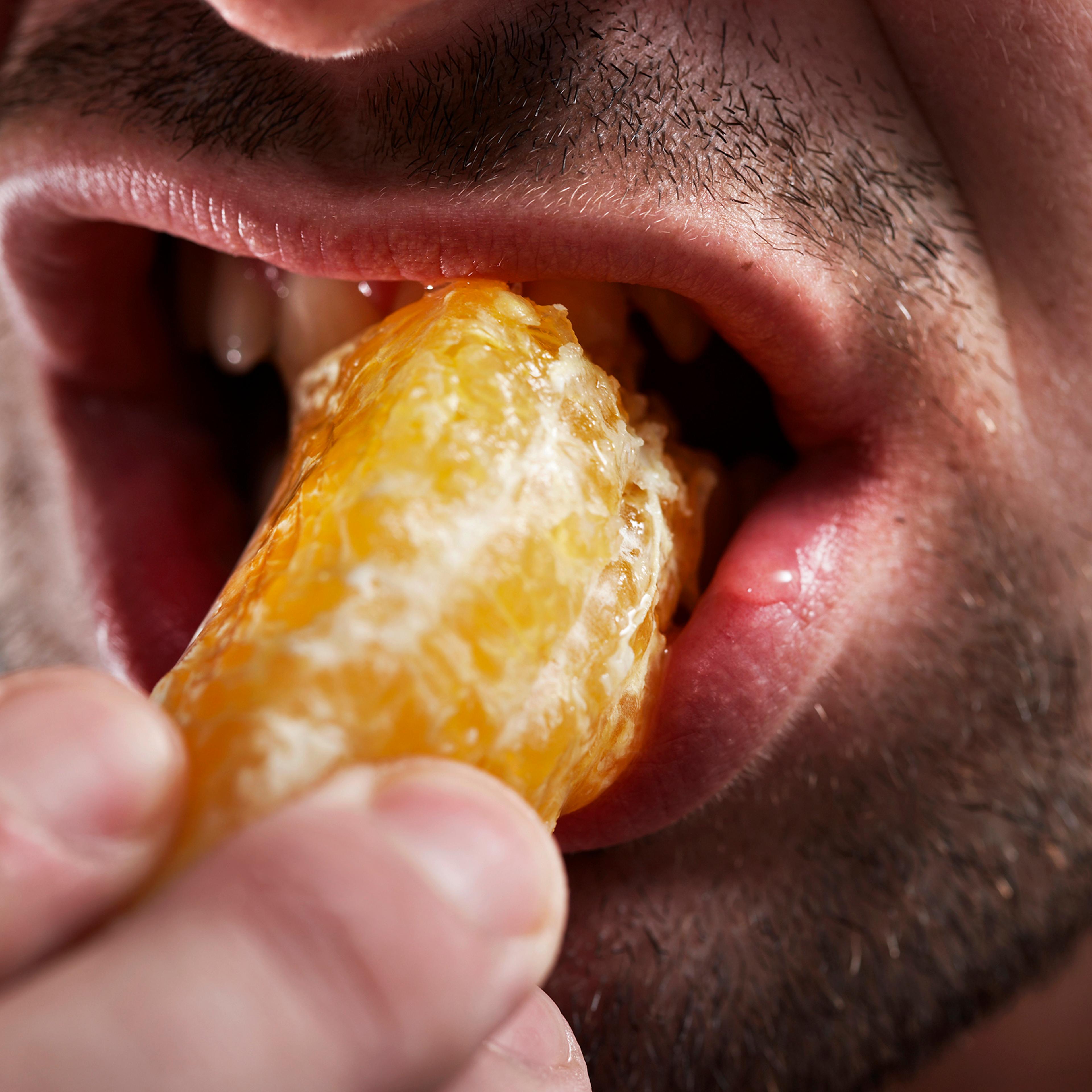 Man eating fruit