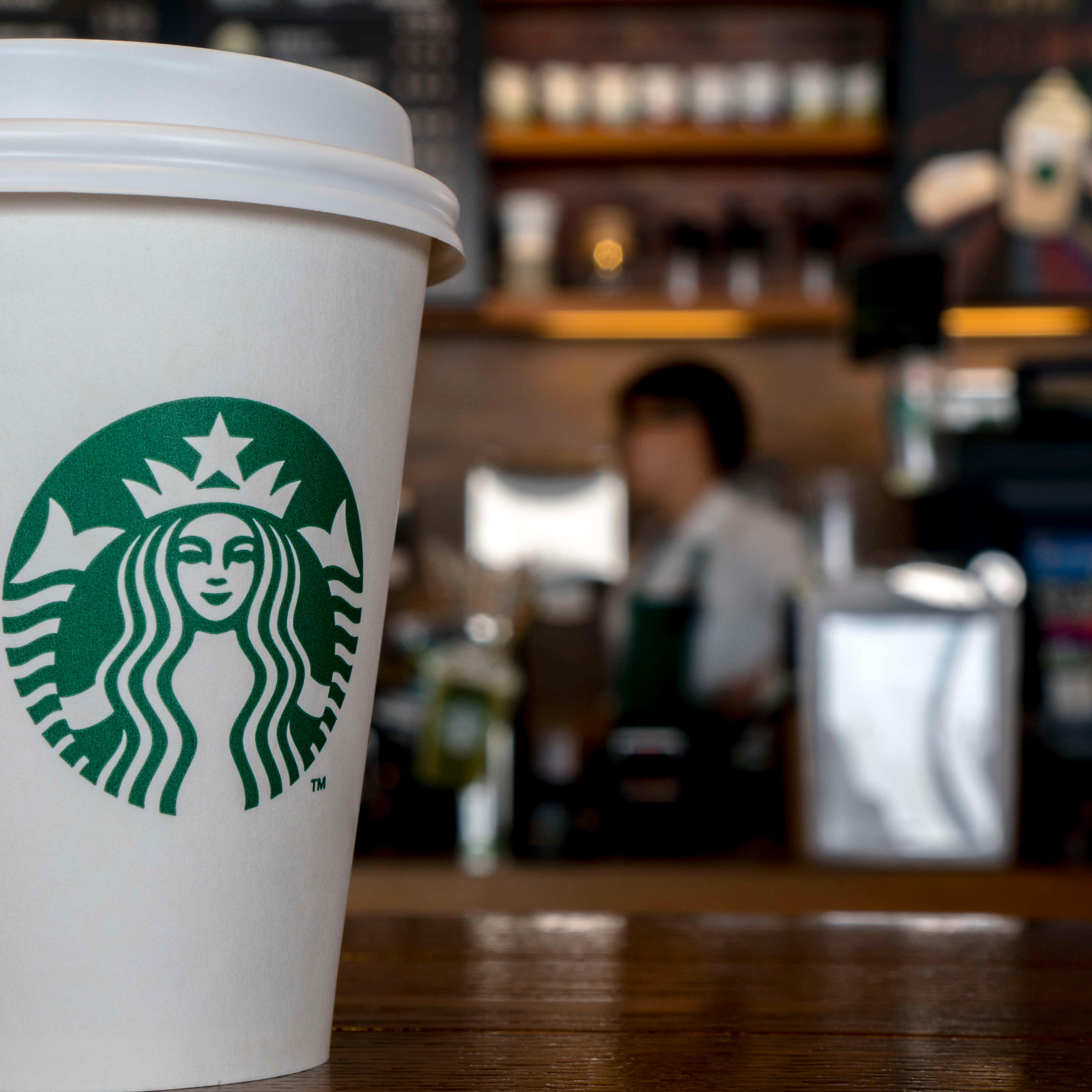 Paper cup in a Starbucks coffee shop. During the third