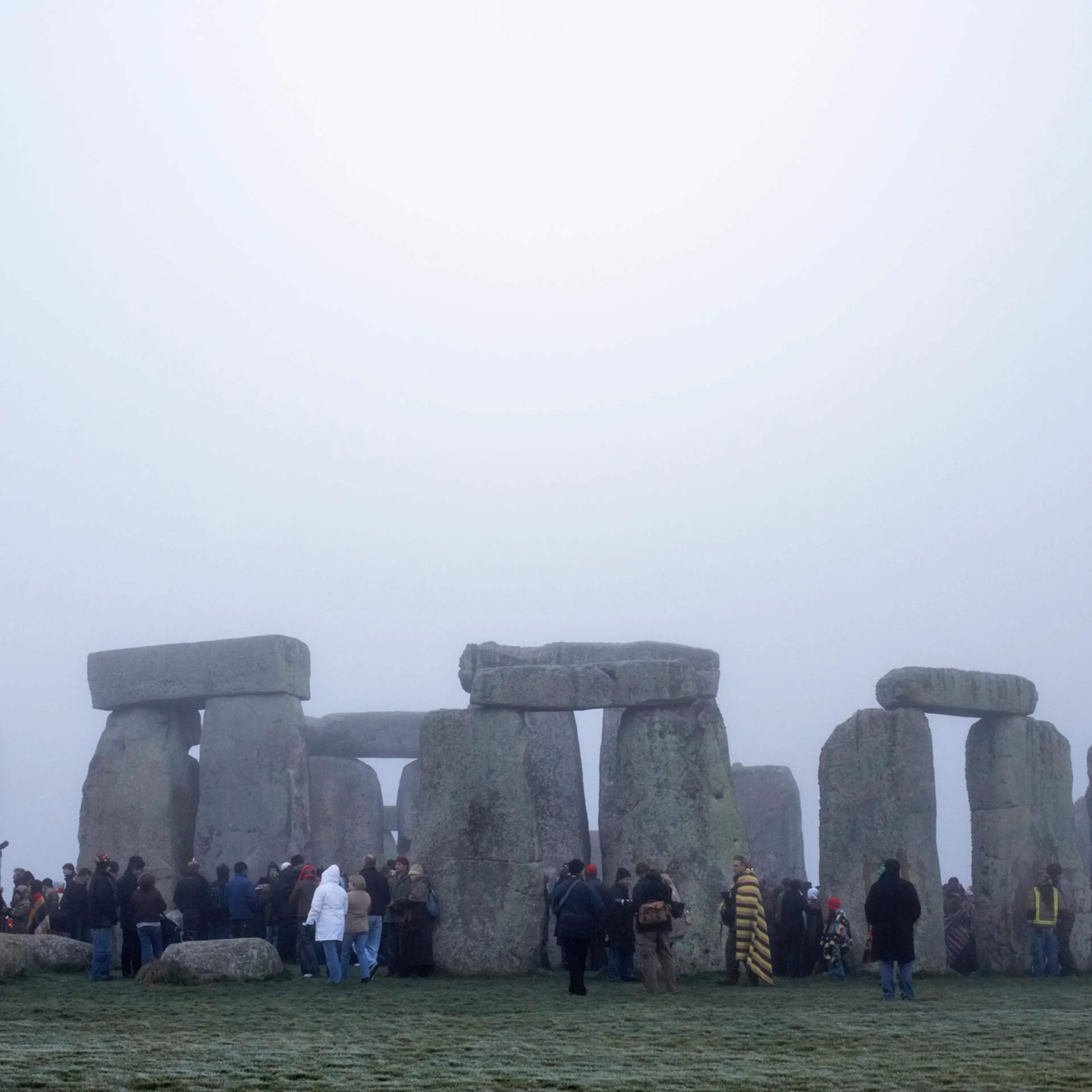 Tourist at Stonehenge in winter