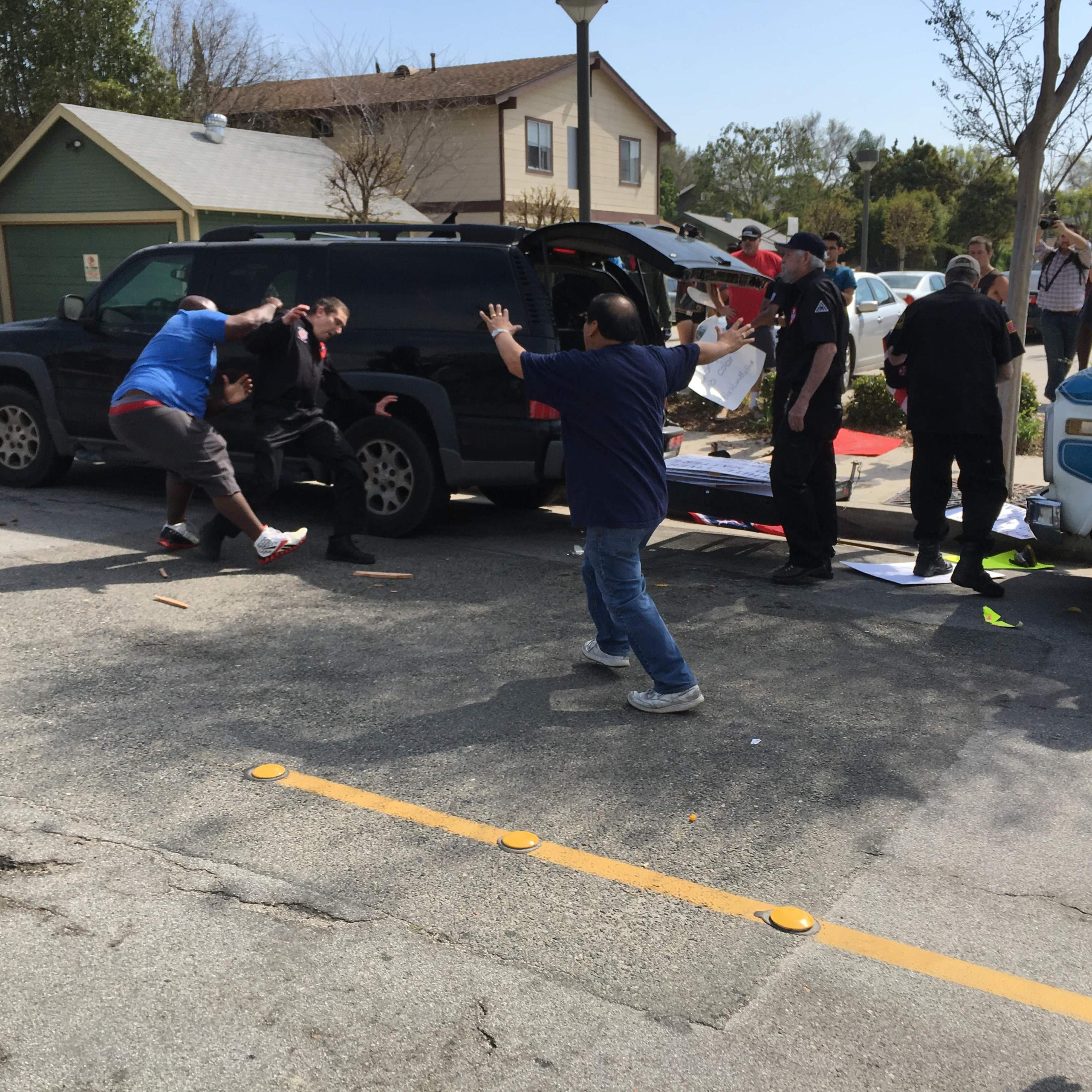 This handout picture obtained courtesy of the Center for the Study of Hate and extremism shows a counter-protester (L) tackling a member of the Ku Klux Klan during a KKK rally in Anaheim, Calif., Feb. 27, 2016.
