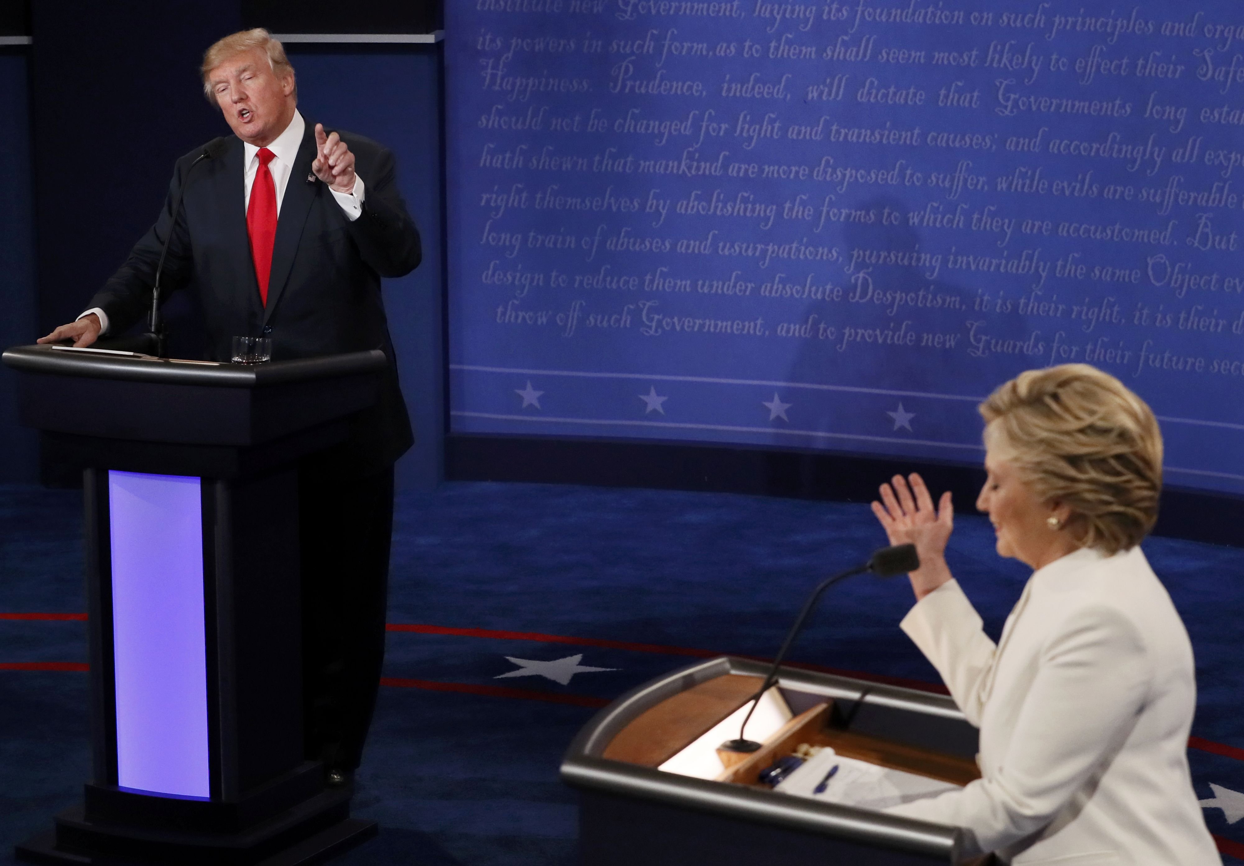 Trump speaks as Clinton listens during their third and final 2016 presidential campaign debate at UNLV in Las Vegas