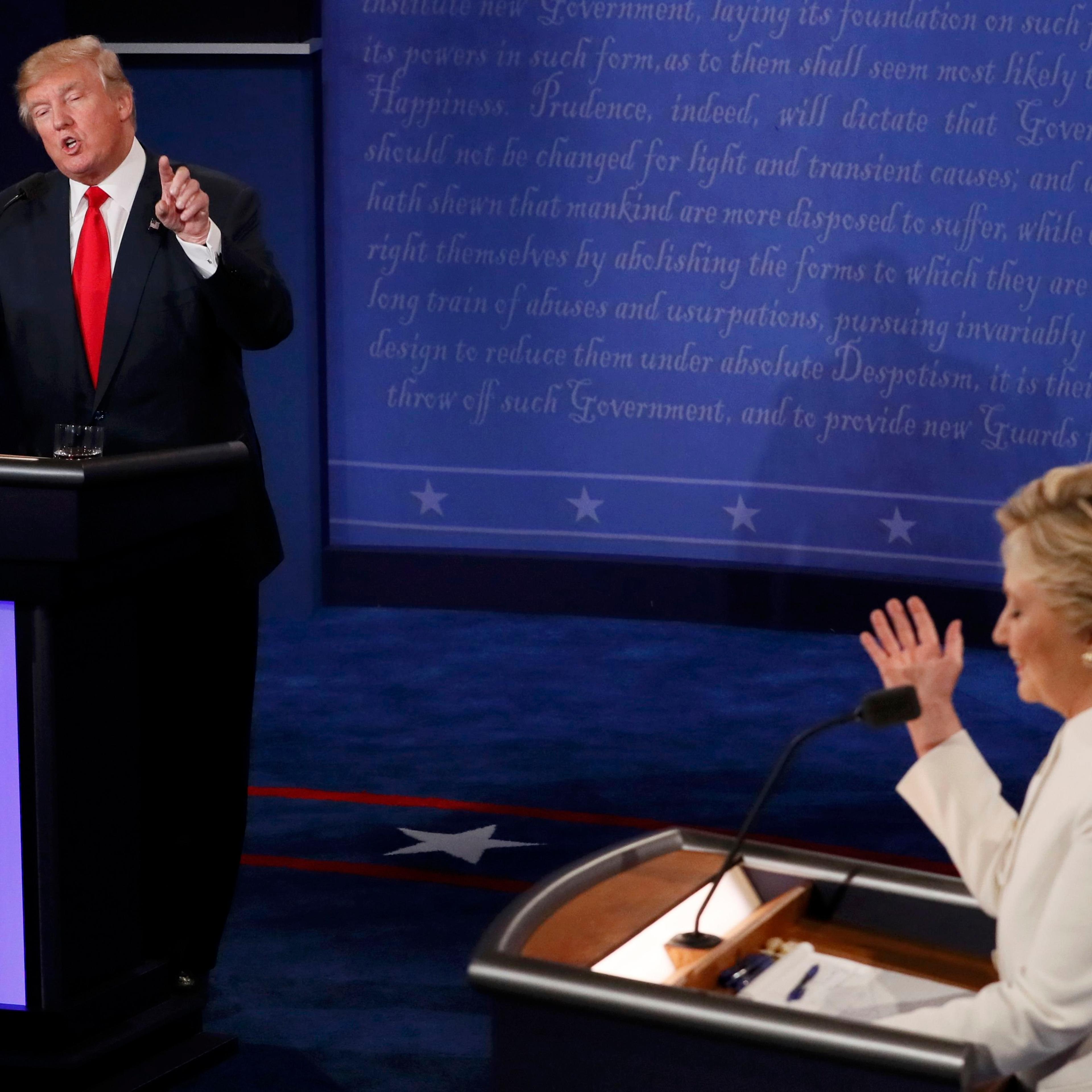 Trump speaks as Clinton listens during their third and final 2016 presidential campaign debate at UNLV in Las Vegas