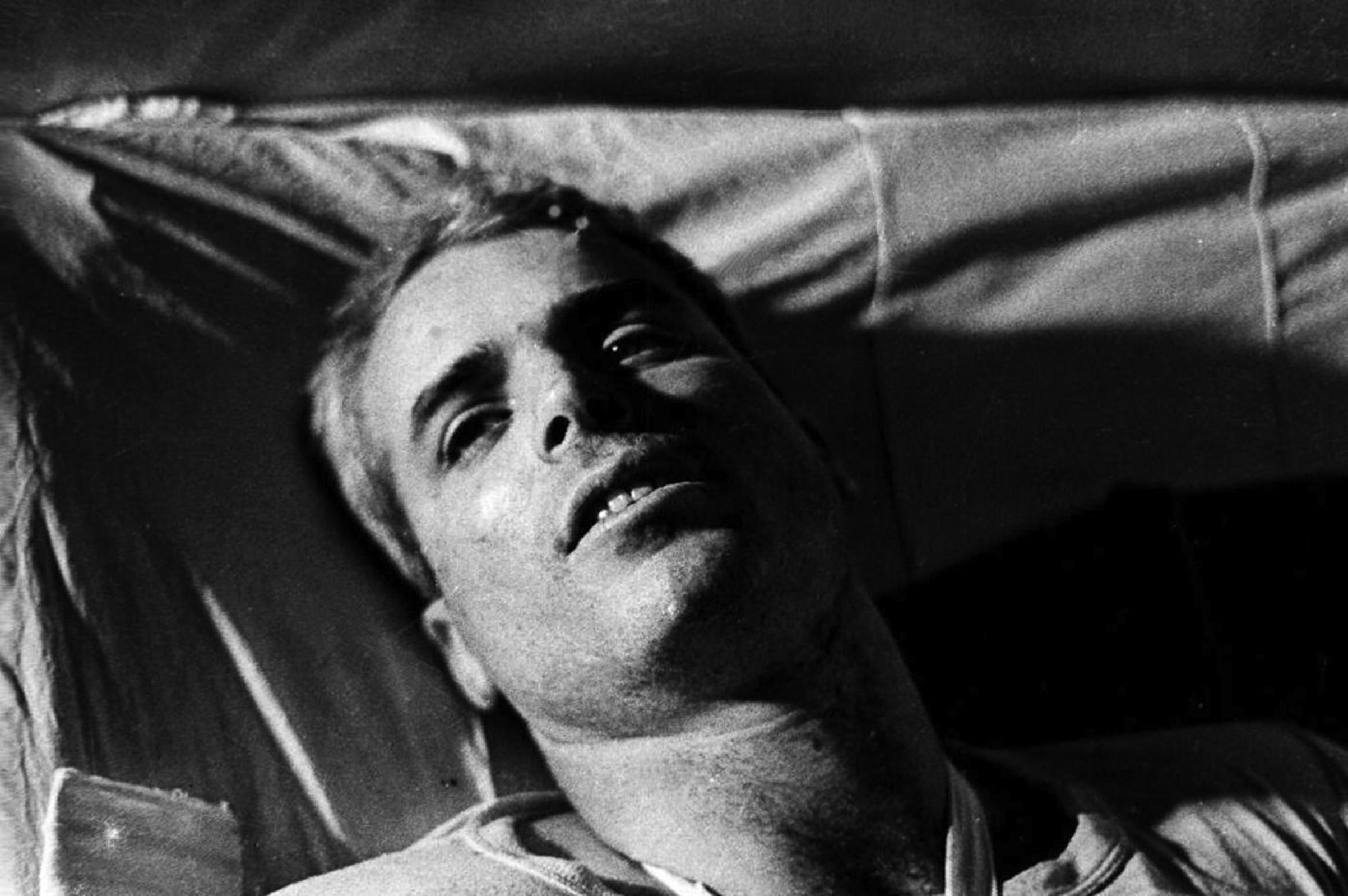 This file picture taken in 1967 shows US Navy Airforce Major John McCain lying on a bed in a Hanoi hospital