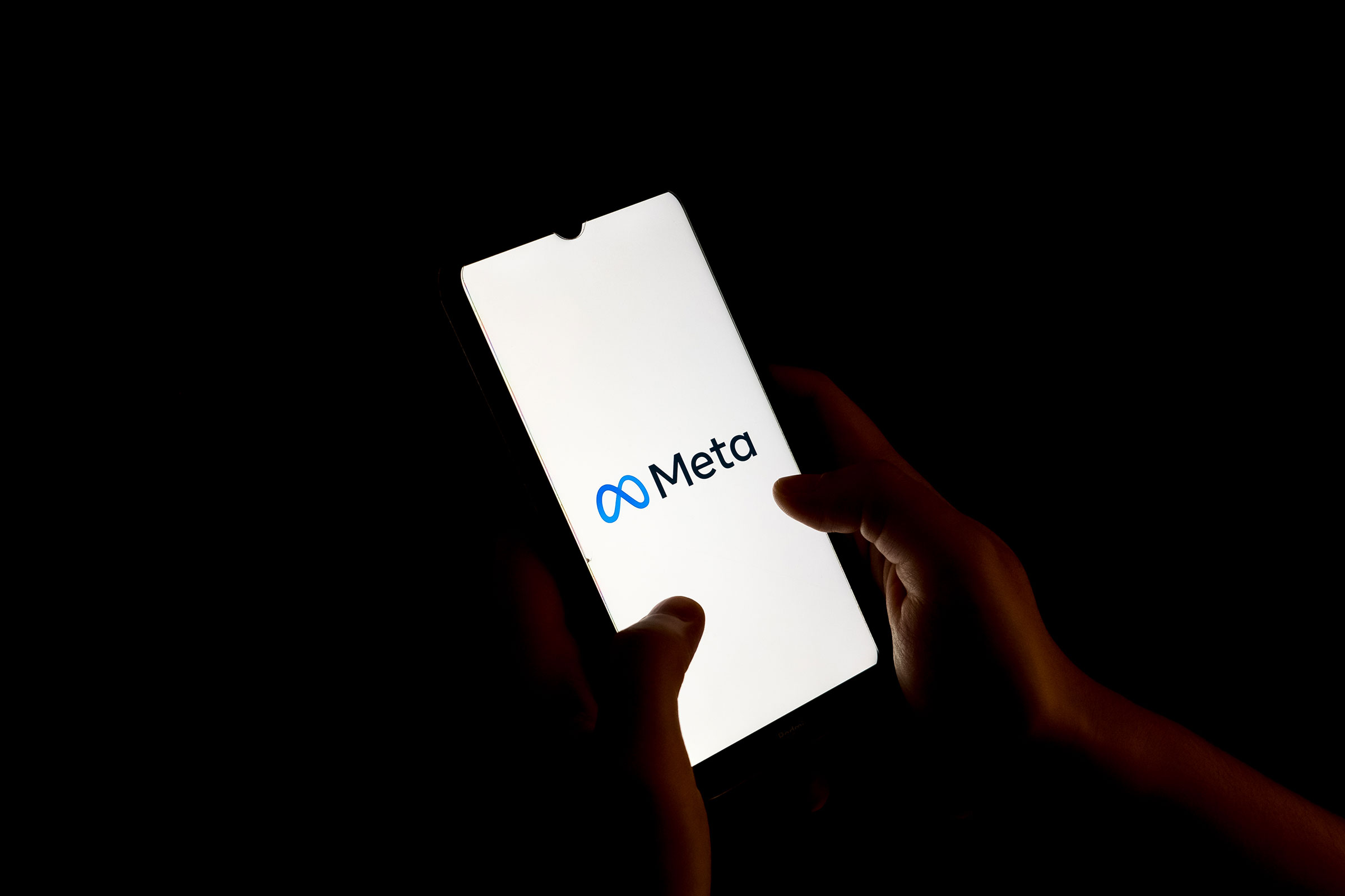 The Meta logo seen on a phone screen