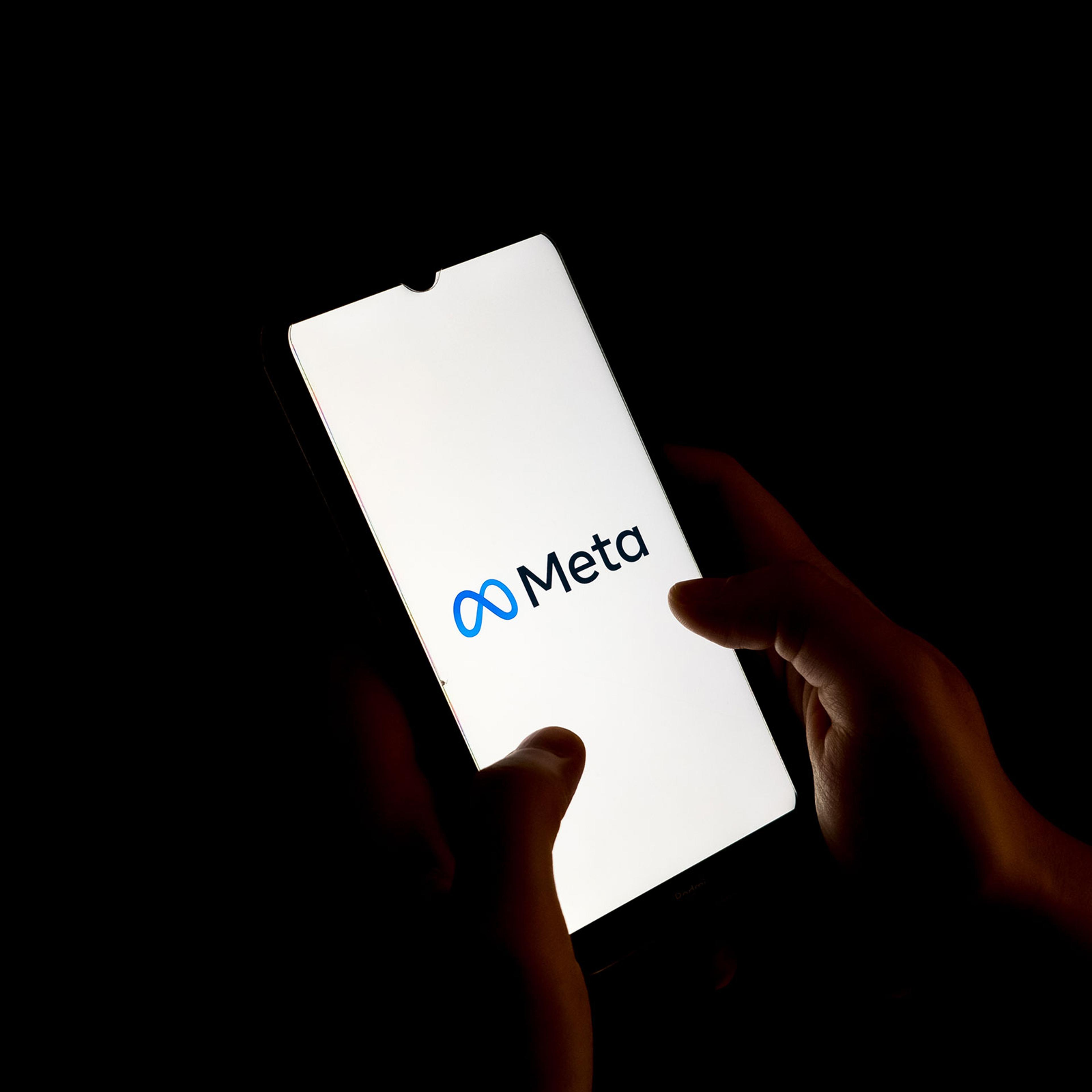 The Meta logo seen on a phone screen