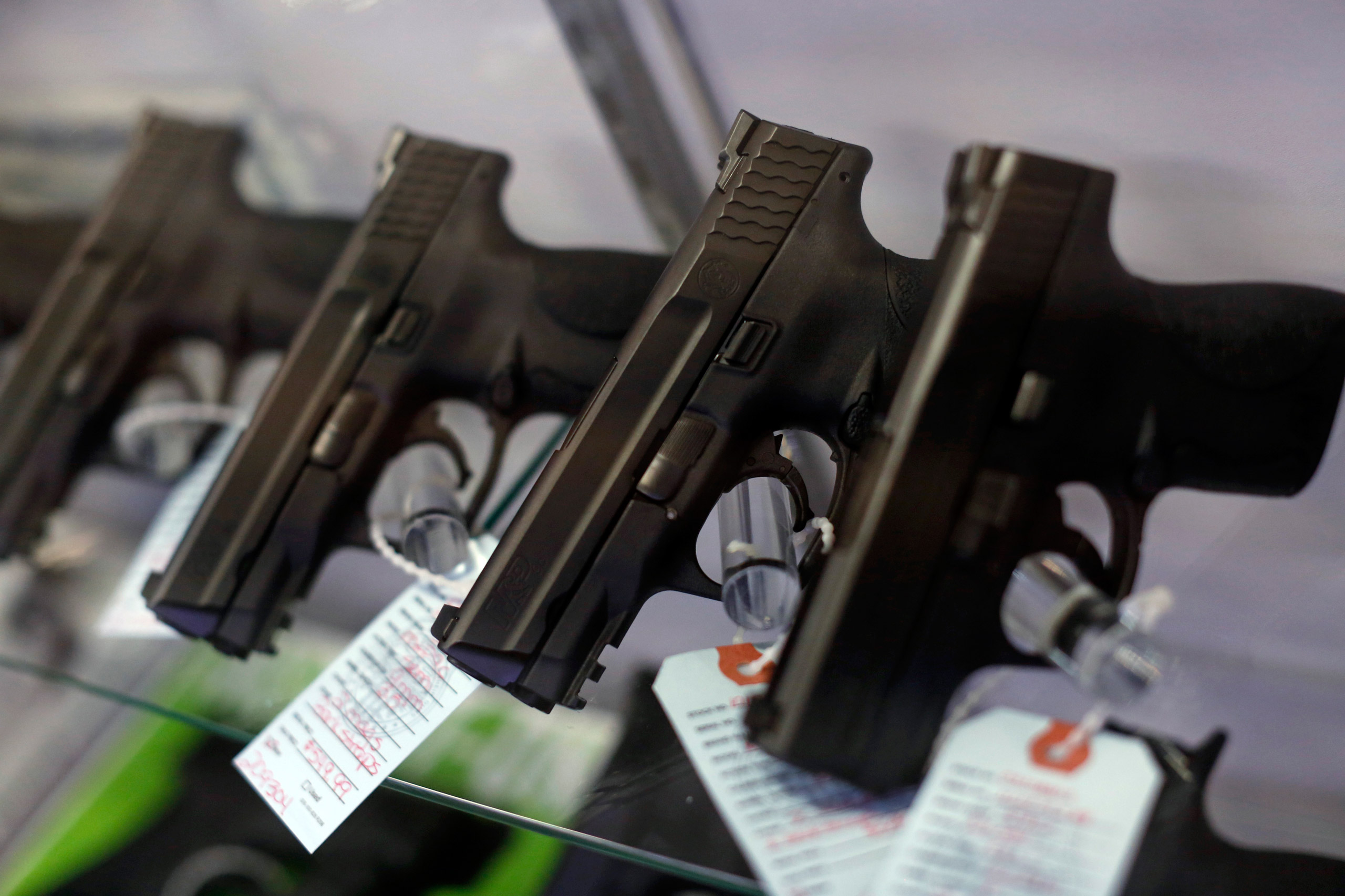 Handguns are seen for sale in a display case at Metro Shooting Supplies in Bridgeton, Missouri, November 13, 2014. The store has reported an increase in gun sales as the area waits for a grand jury to reach a decision this month on whether to indict Darr