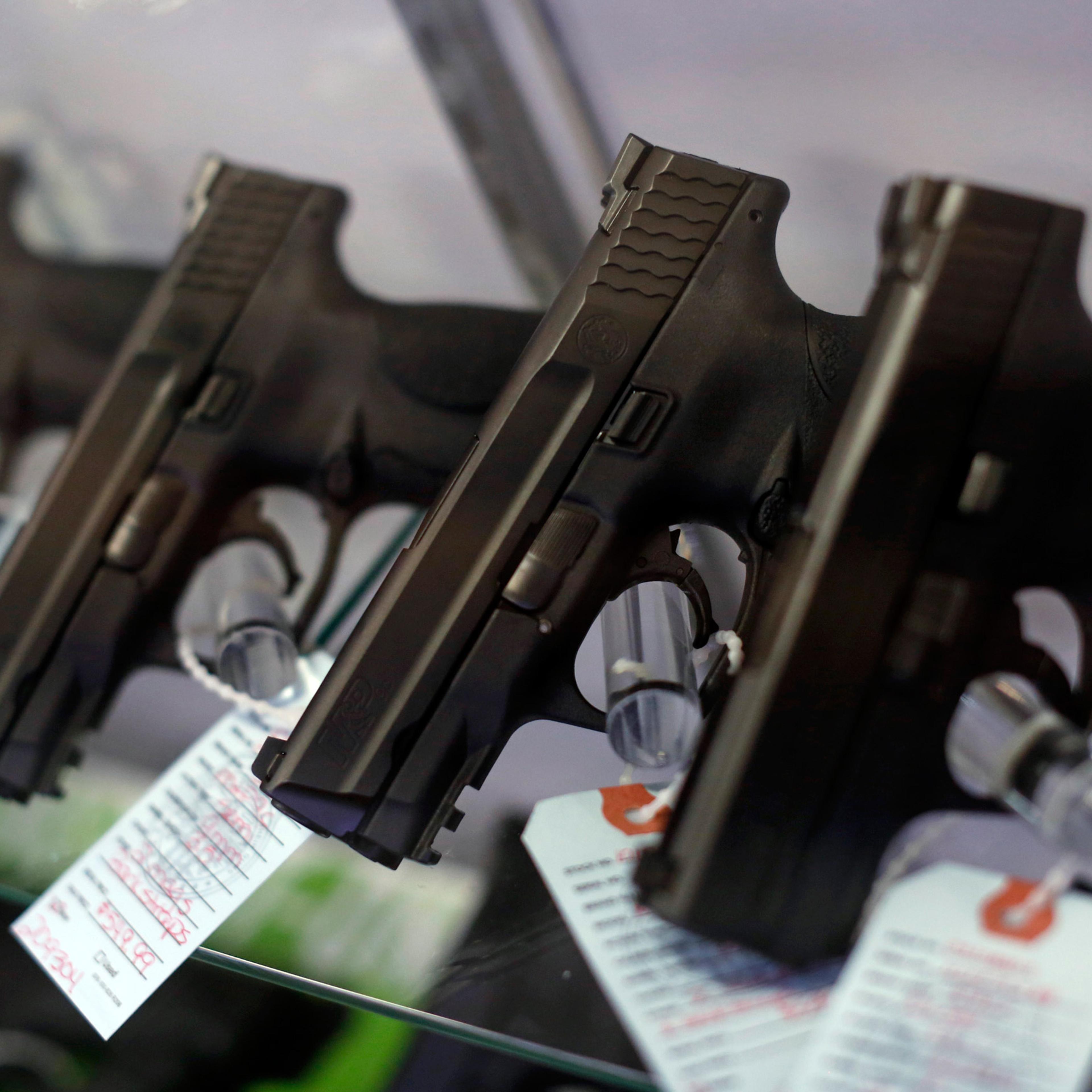 Handguns are seen for sale in a display case at Metro Shooting Supplies in Bridgeton, Missouri, November 13, 2014. The store has reported an increase in gun sales as the area waits for a grand jury to reach a decision this month on whether to indict Darr