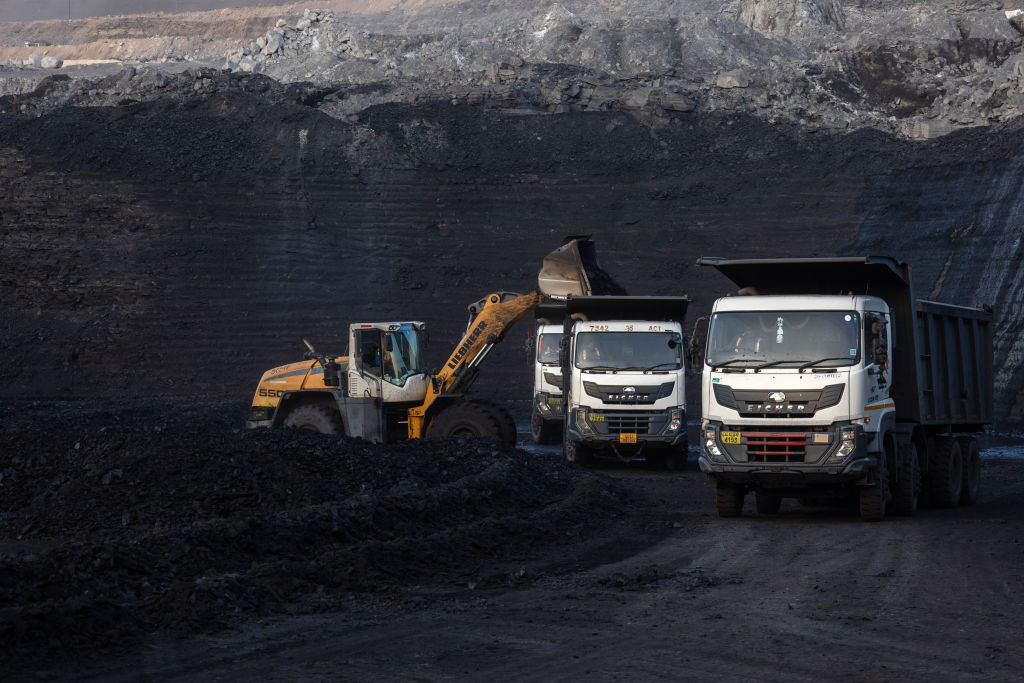 A loader fills dump trucks at the coal mine, operated by South Eastern Coalfields Ltd., in Gevra, Chhattisgarh, India, on Wednesday, May 10, 2023.