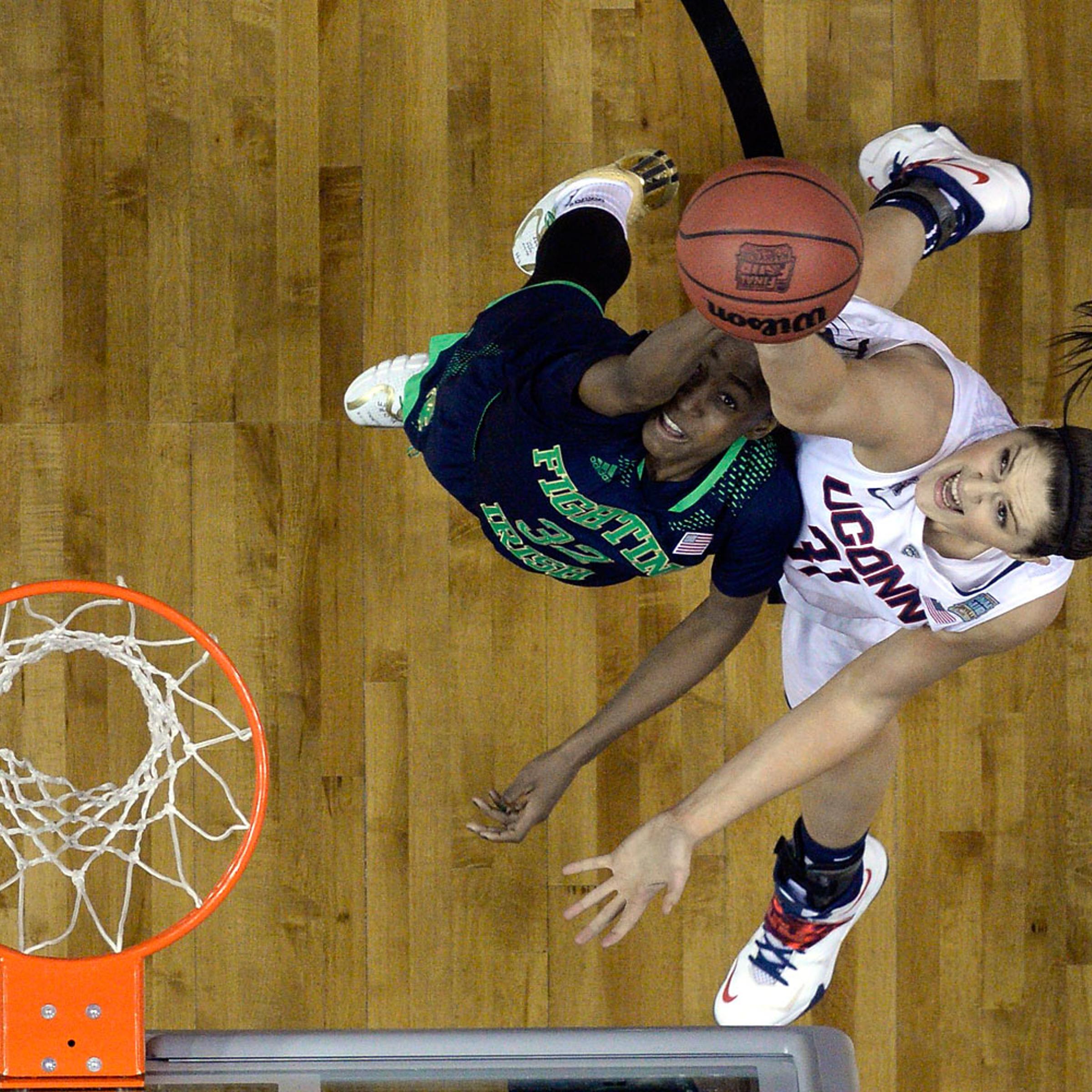 NCAA Connecticut Huskies center Stefanie Dolson shoots against Notre Dame Fighting Irish guard Jewell Loyd during the second half of the championship game of the Final Four in the 2014 NCAA Womens Division I Championship tournament at Bridgestone Arena,