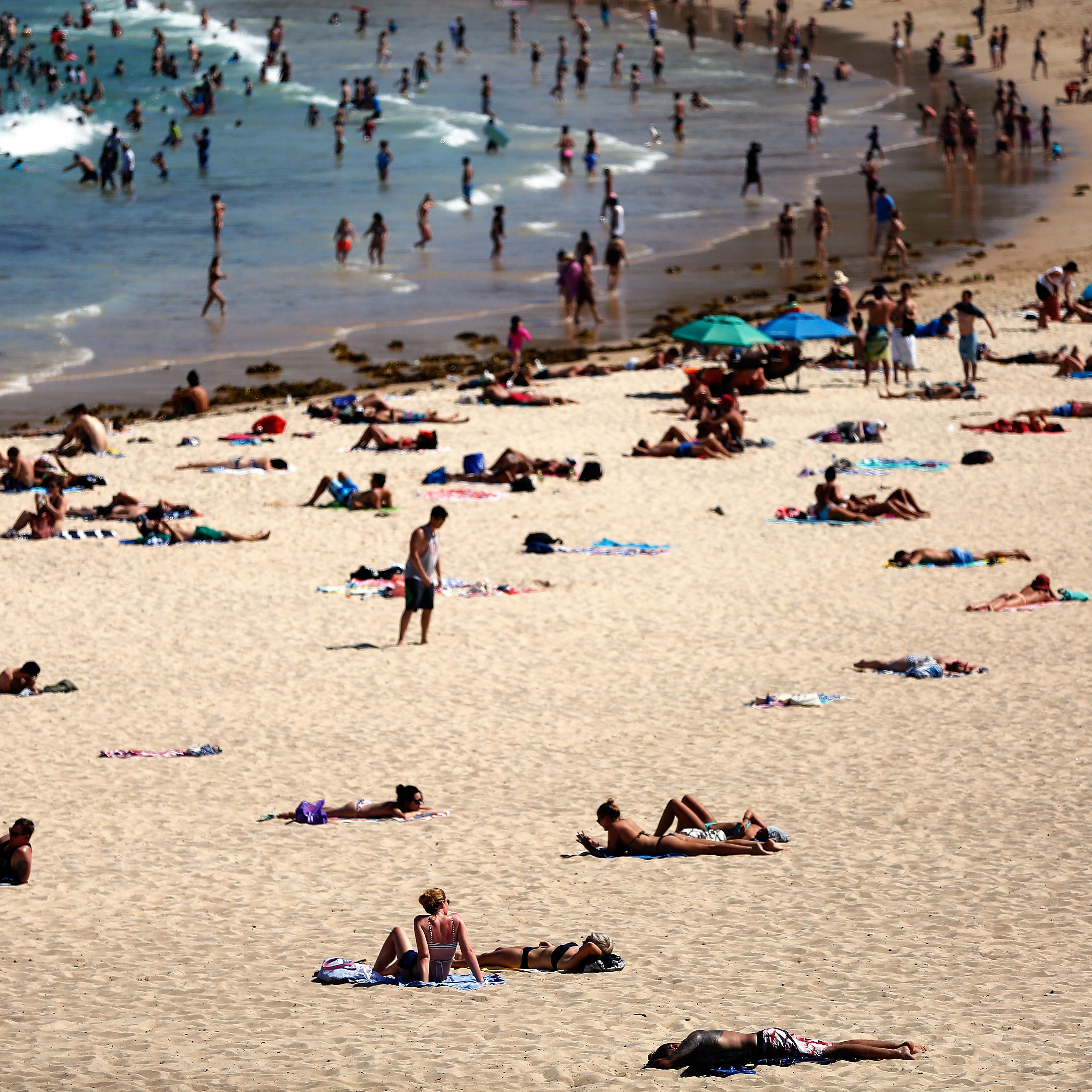 Beachgoers enjoy the hot weather at Coogee Beach on Jan. 13, 2016 in Sydney.