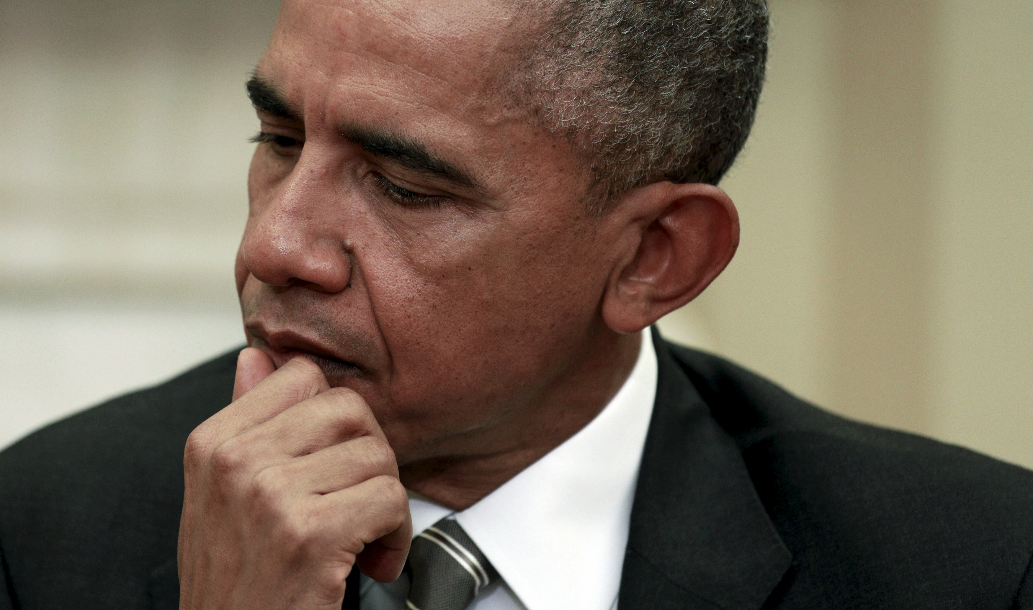 U.S. President Barack Obama listens as German President Joachim Gauck speaks during their meeting in the Oval Office of the White House in Washington