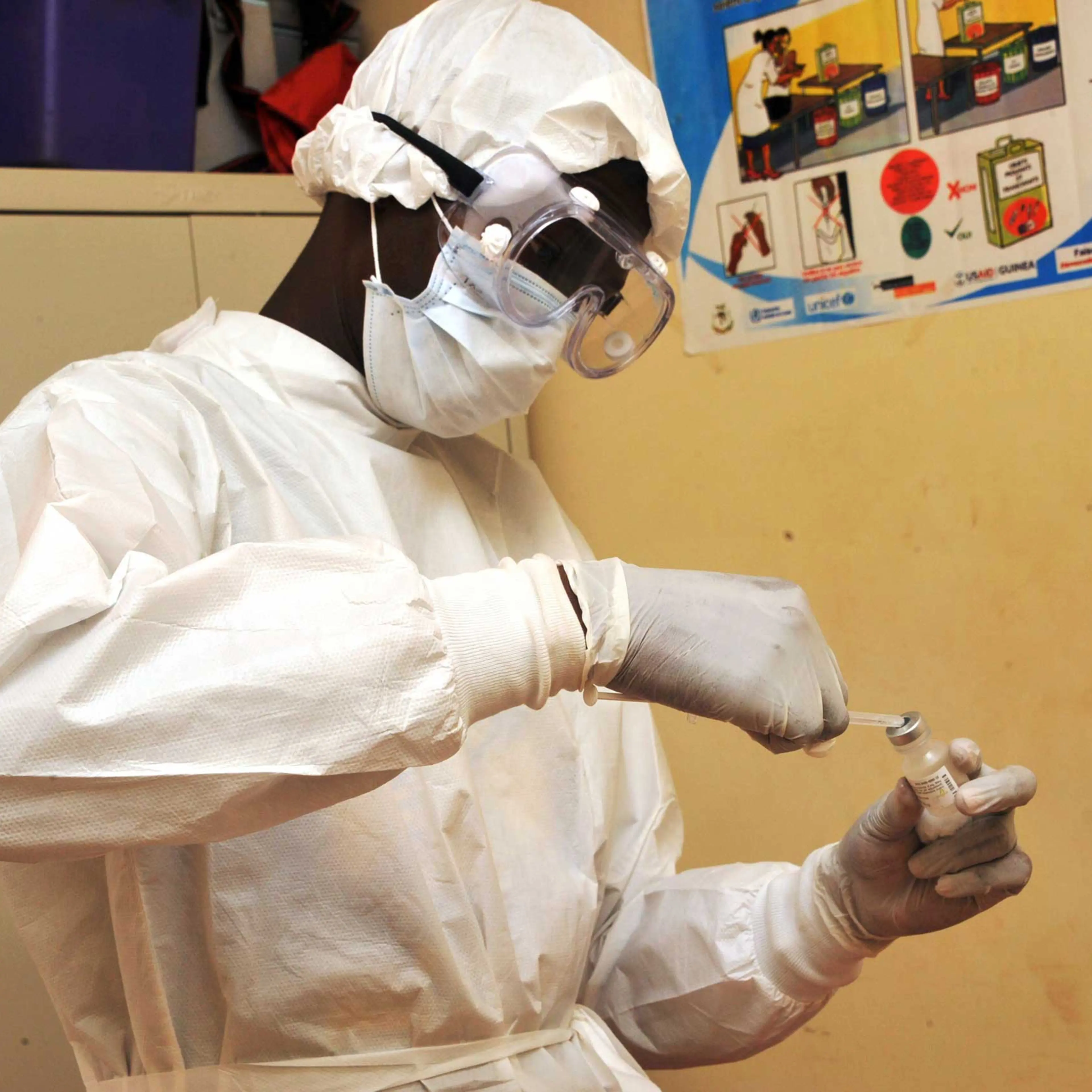 A health worker prepares a vaccination on March 10, 2015 at a health center in Conakry during the first clinical trials of the VSV-EBOV vaccine against the Ebola virus.
