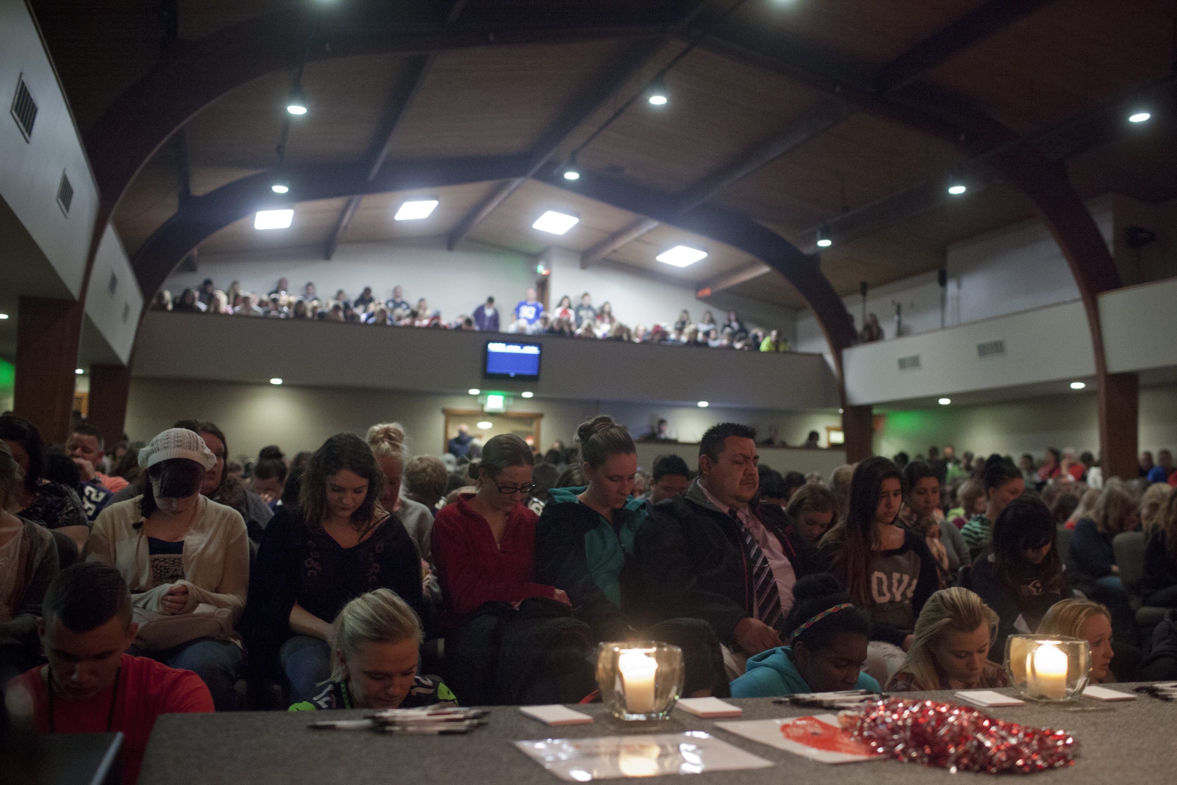 Students and community members attend a vigil at the Grove Church, after a school shooting that occurred at Marysville-Pilchuck High School earlier in the day in Marysville, Wash., on Oct. 24, 2014 