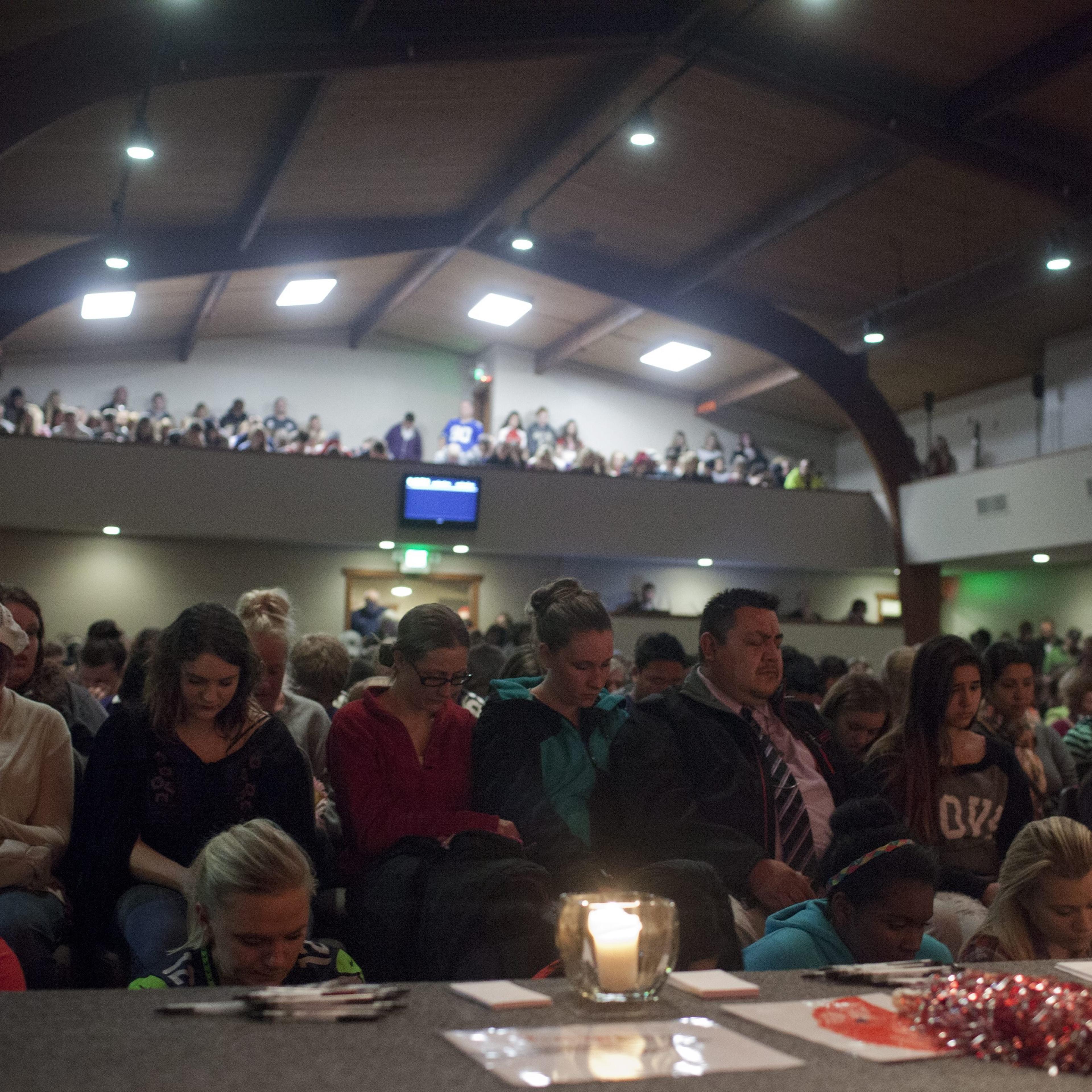 Students and community members attend a vigil at the Grove Church, after a school shooting that occurred at Marysville-Pilchuck High School earlier in the day in Marysville, Wash., on Oct. 24, 2014