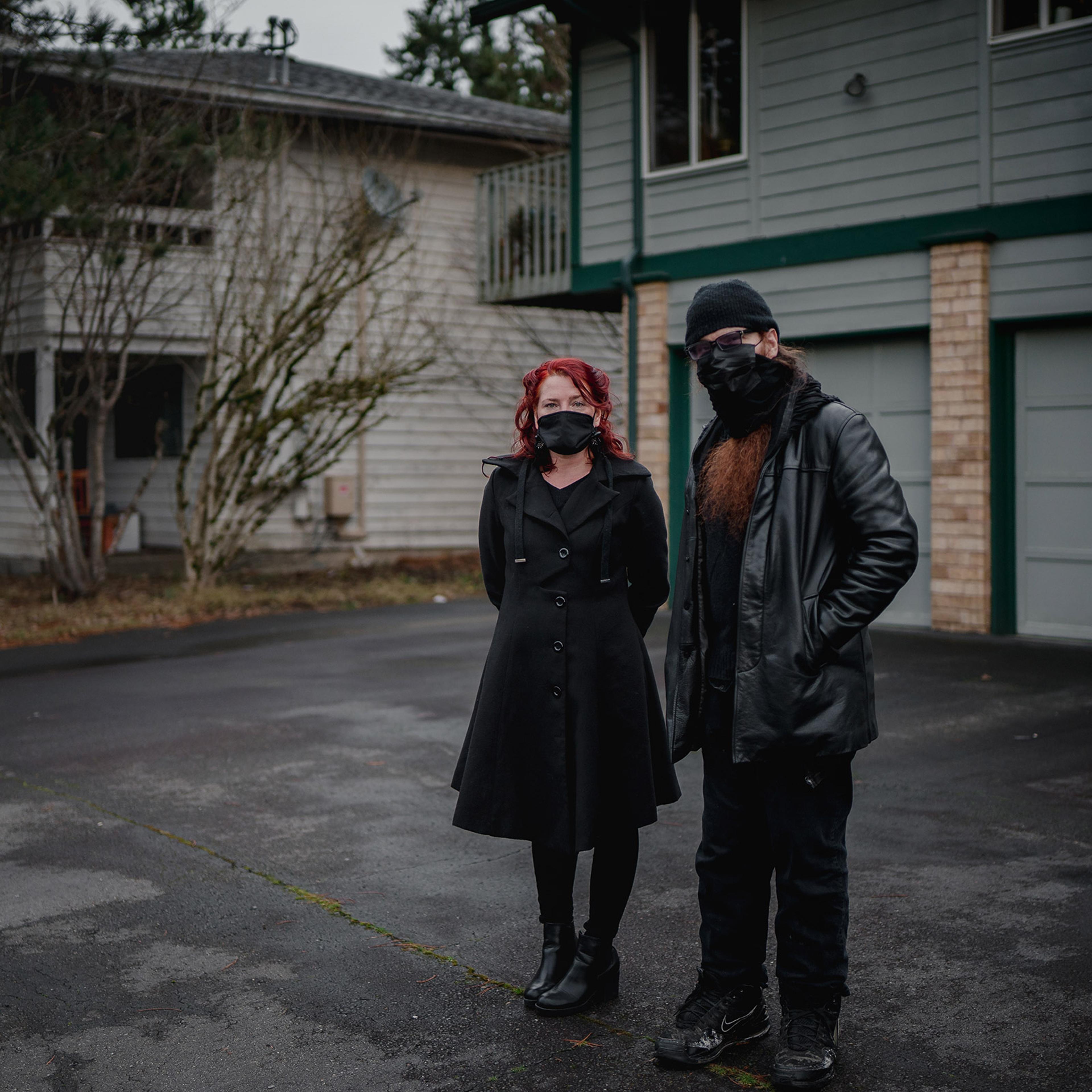 Landlord Rian de Laat, left, and tenant Ollie Aldama, in front of the condo that Aldama rents from de Laat in Seattle.